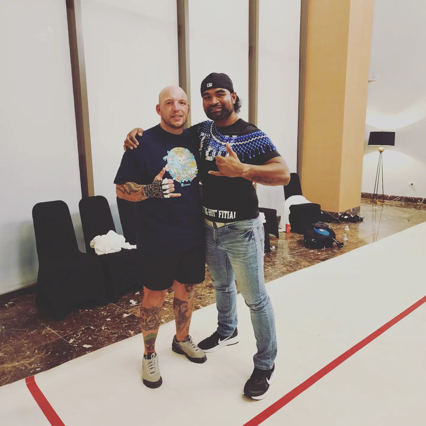 Kelvin "The Big Hit" Fitial, right, and Ben Schneider pose for a photo after their heavyweight fight Friday at the Dusit Thani Resort on Guam.Contributed photo
