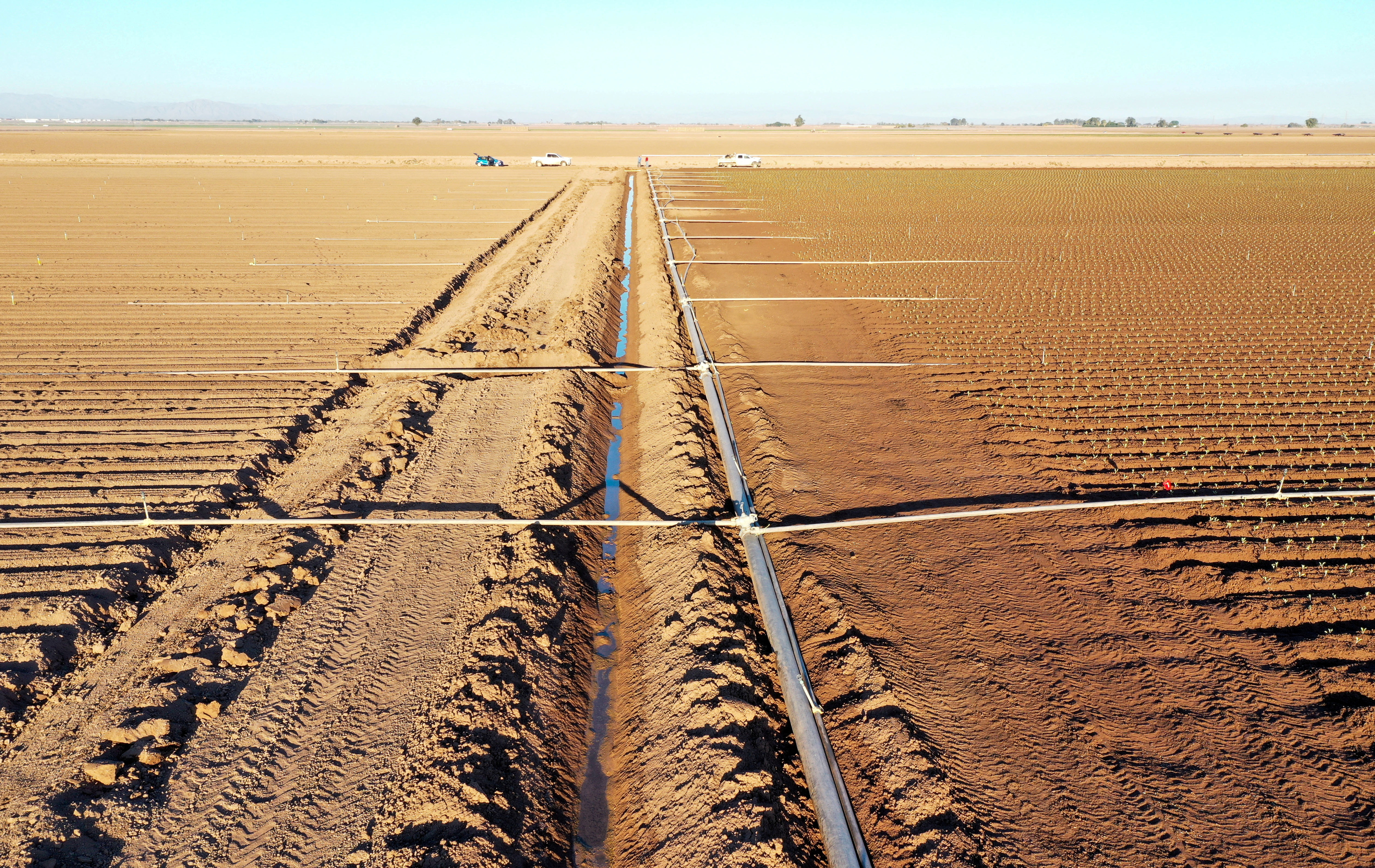 A view of fields, irrigation canal and pipes in Holtville, California on Sept. 20, 2022.