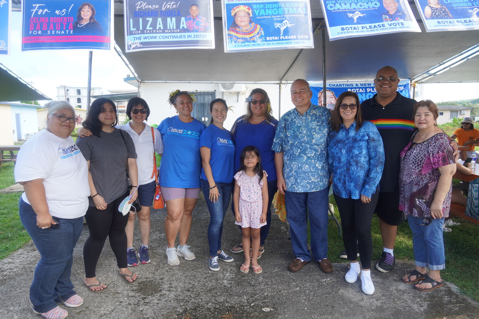 Democratic candidate for governor Rep. Tina Sablan with running mate Rep. Leila Staffler, U.S. Congressman Gregorio Kilili Camacho Sablan and Democratic House Precinct 3 candidate Lauren Yvonne S. Pangelinan pose for a photo with family members and supporters in Precinct 3  Tuesday morning.