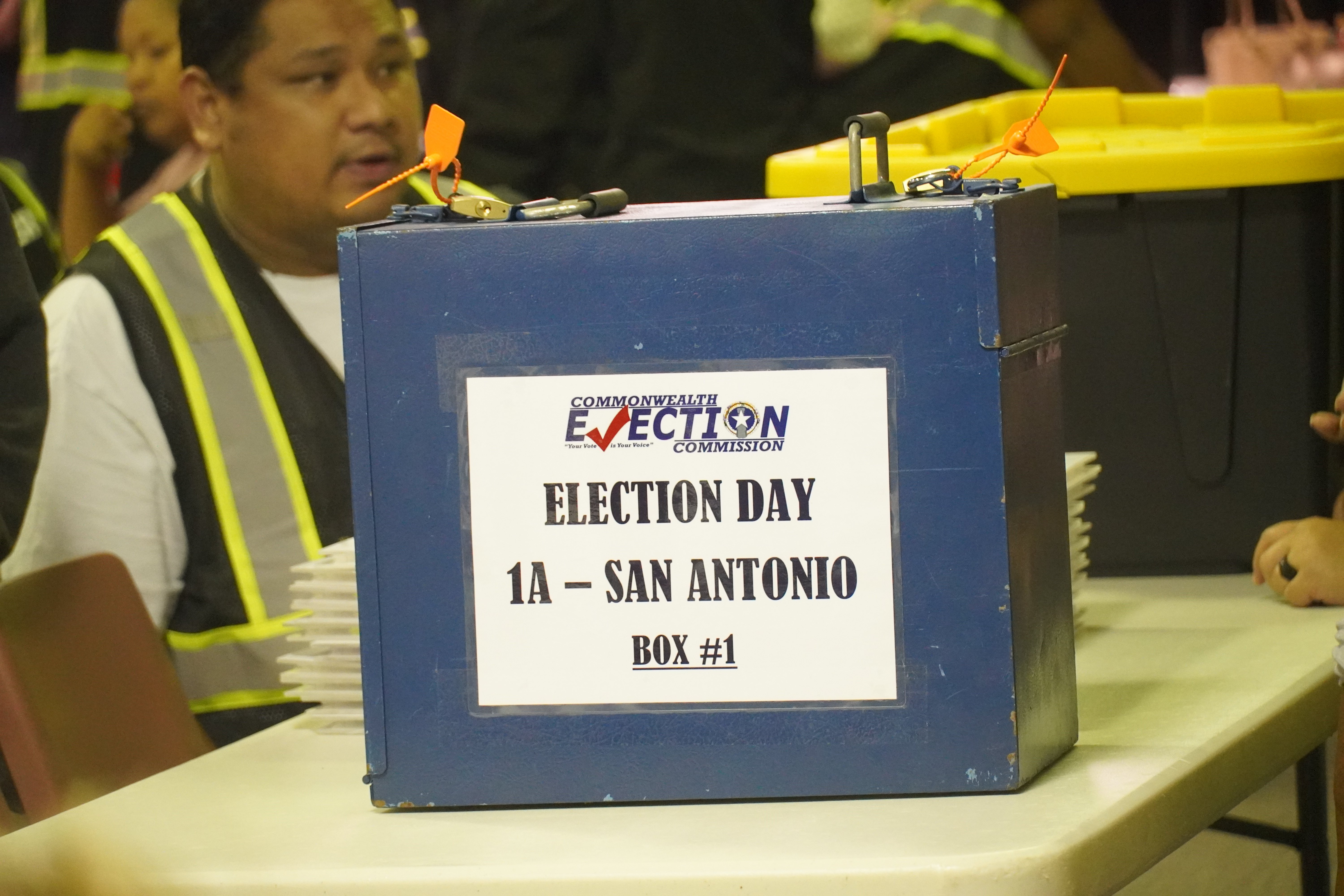 A ballot box sits atop a table, waiting for the official count.