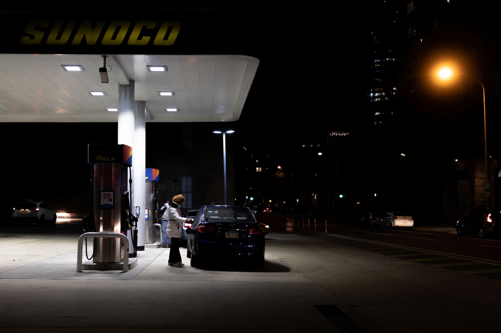 A person pumps gas at a Sunoco gas station after the inflation rate hit a 40-year high in January, in Philadelphia, Pennsylvania, Feb. 19, 2022.