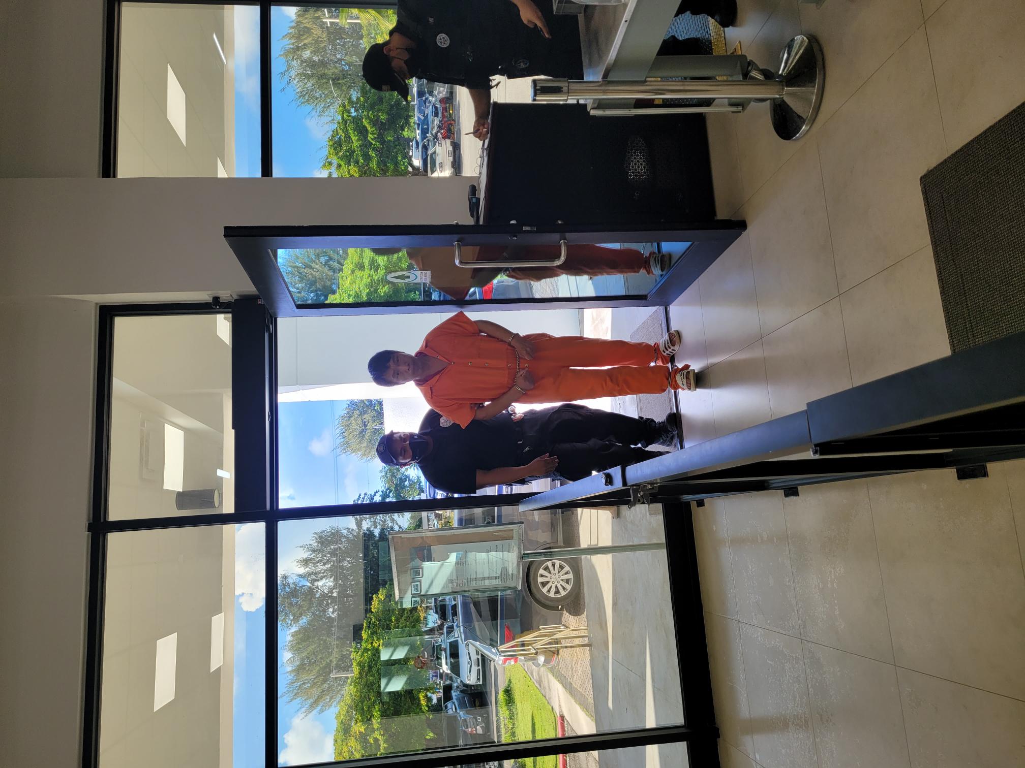 Escorted by a Corrections officer,  Jian Hao Yang enters the Guma Hustisia on Friday morning for a bail hearing.