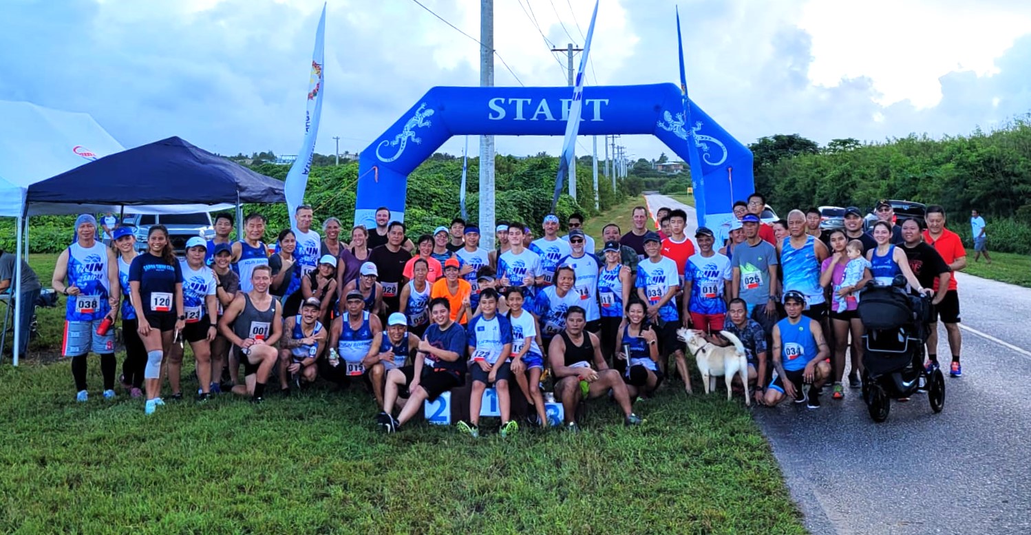 The participants pose for a photo after completing the inaugural Saipan International Airport Trail Run Saturday on Continental Road near United Air Cargo.