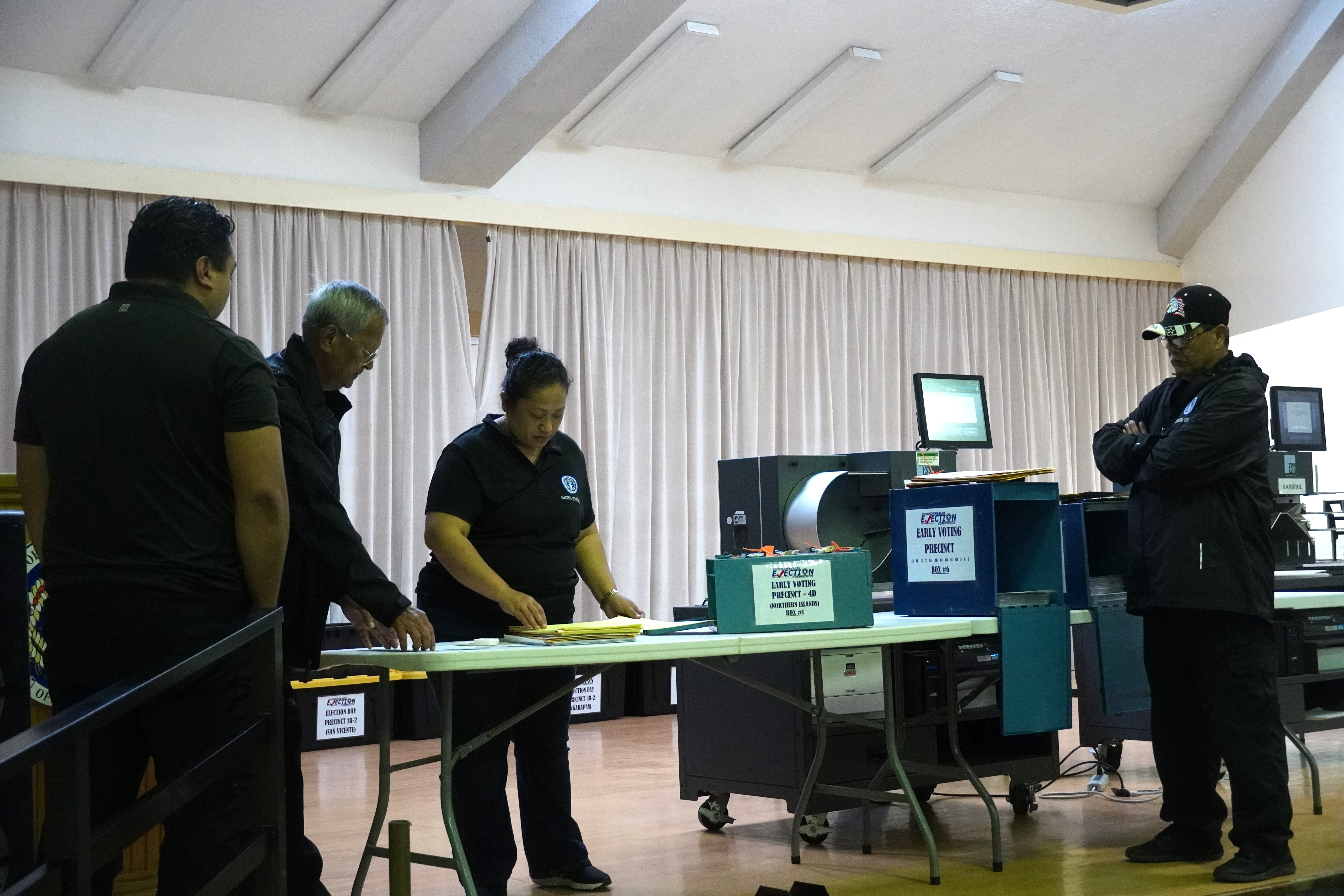 From left, Commonwealth Election Commission member Christopher Jonathan Manglona, Chair Jesus I. Sablan, Executive Director Kayla S. Igitol, and member Jesus S. Cepeda verify the 139 ballots in the Northern Islands early voting ballot box on election night, Nov. 8, 2022.