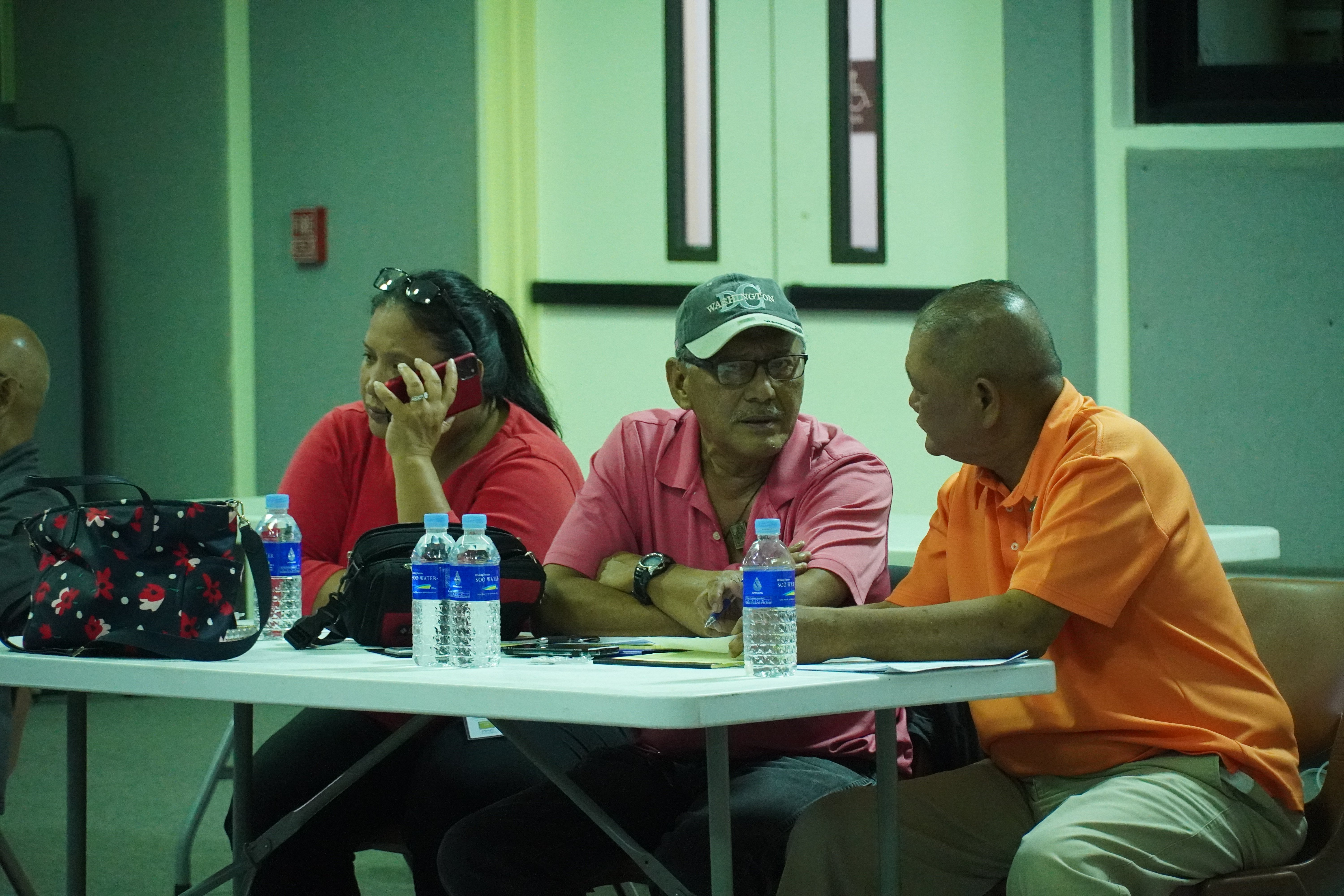 NMI Republican Party poll observers Candace Celis, Rufin Inos and James Ada at the multi-purpose center on election night, Nov. 8, 2022.