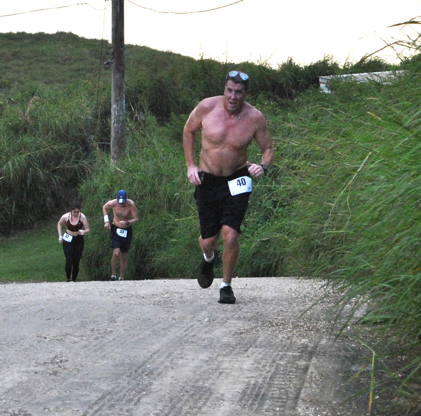 Travis Spaeth pushes through for the finish to top the 40-49 age group of Turkey Trot 2022 on Thursday at Mt. Tapochao.