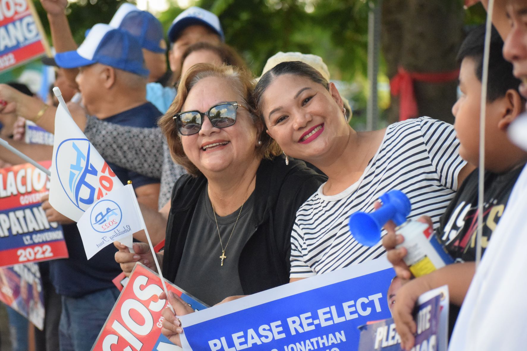 Rep. Corina Magofna and supporters wave to motorists during a campaign event on Beach Road in San Jose last month.