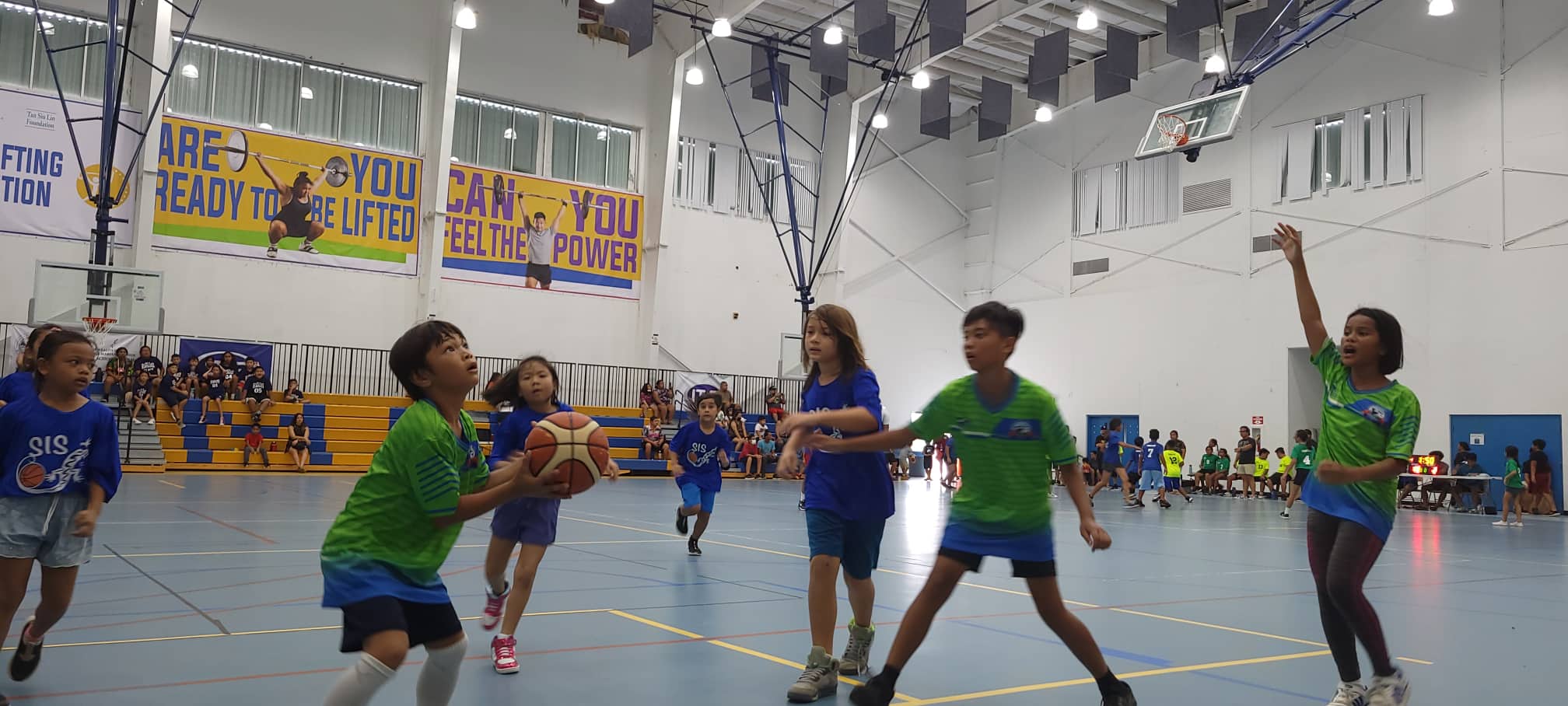 A San Vicente Elementary School 1 player gather for the shot during an elementary school division game of the IT&E Interscholastic Basketball League at the MHS gym.