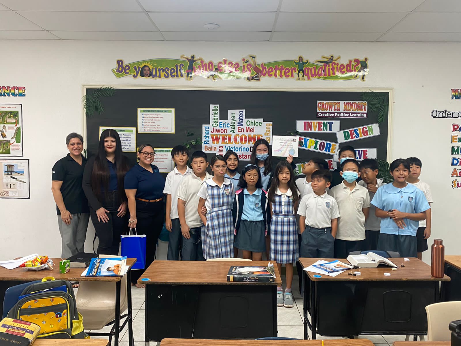 Grace Christian Academy student and Pacifica Art Contest Traditional Category 1 winner Victoria En Mei Huang was joined by her teacher and classmates in accepting her award and cash prize from Pacifica Insurance's Dionne Camacho and Dana Manglona.