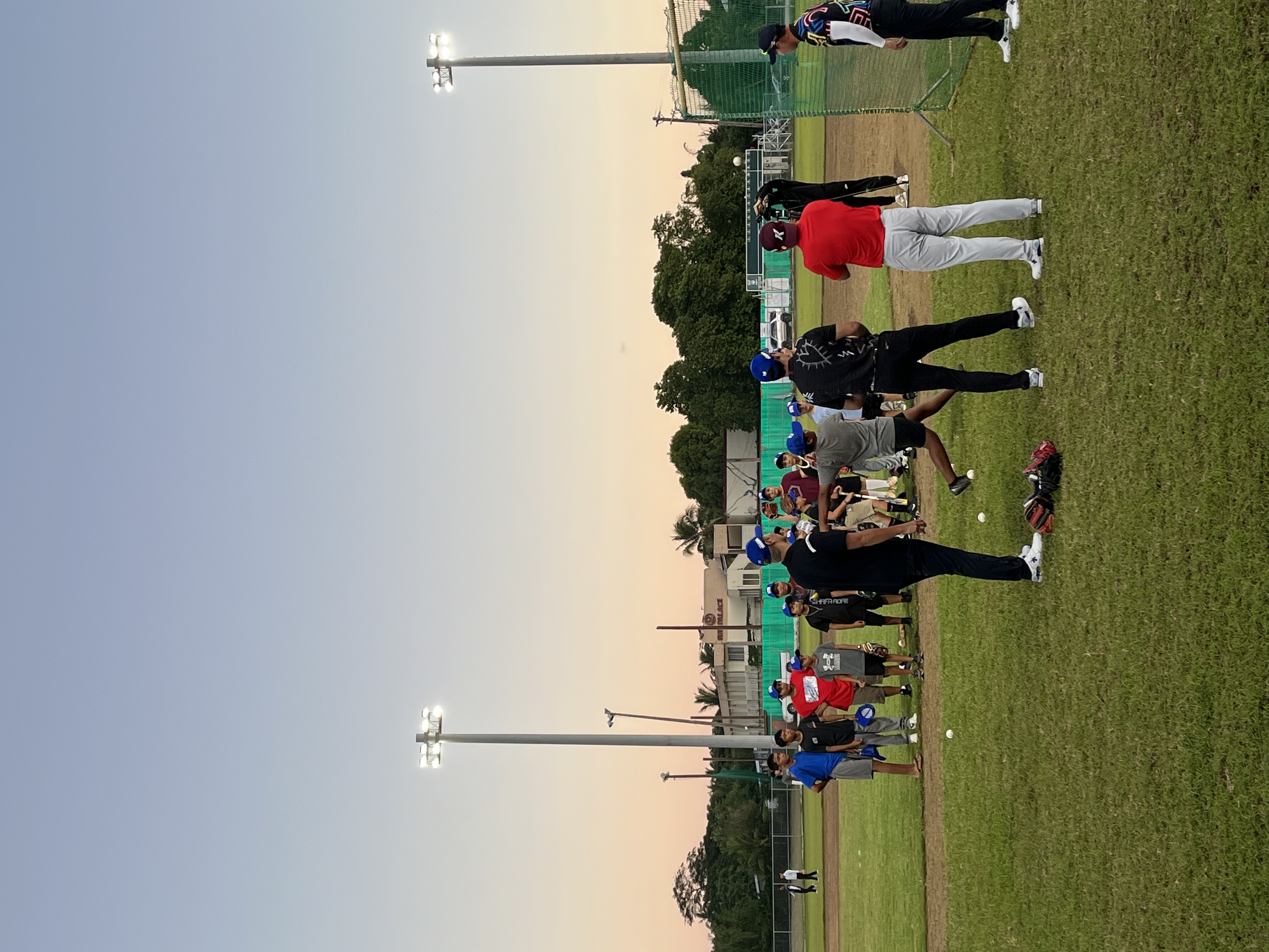 Professional baseball players of South Korea conduct a training clinic for nearly 50 players of the CNMI Little League at the Oleai Sports Complex in Saipan on Dec. 14, 2022.  The players are in the Marianas as a part of a media filming project of the Marianas Visitors Authority in cooperation with MBC TV.
