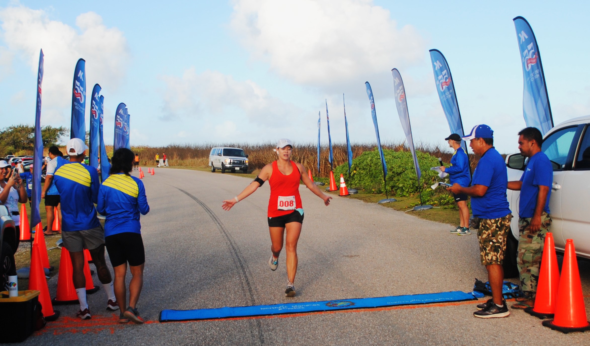 Savannah Grant crosses the finish line of the inaugural Run Saipan Holiday Half Marathon on Saturday at Banzai Cliff.