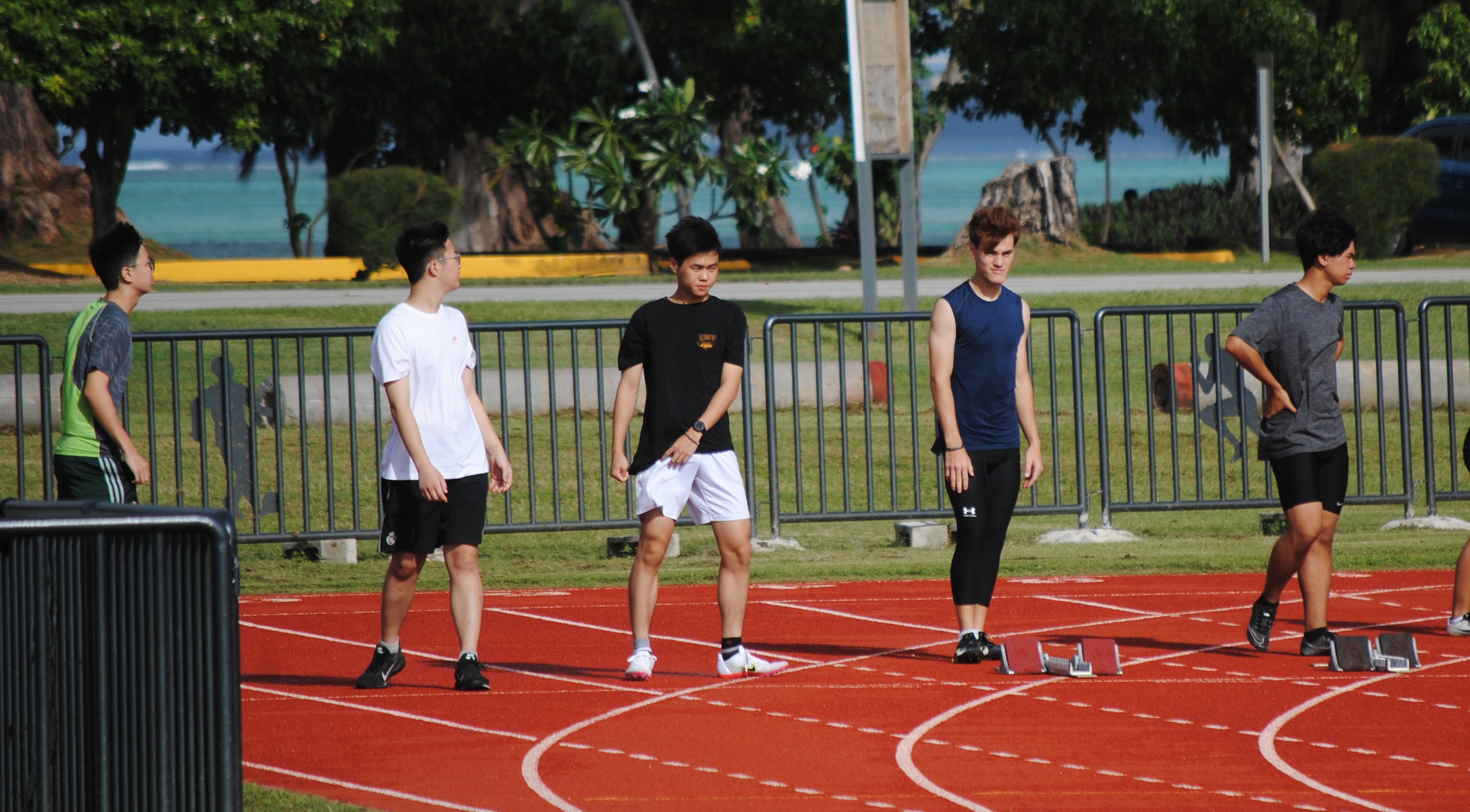 The participants of the 100m sprint get ready for the event during the NMA Track & Field Challenge on Saturday at the Oleai Sports Complex.