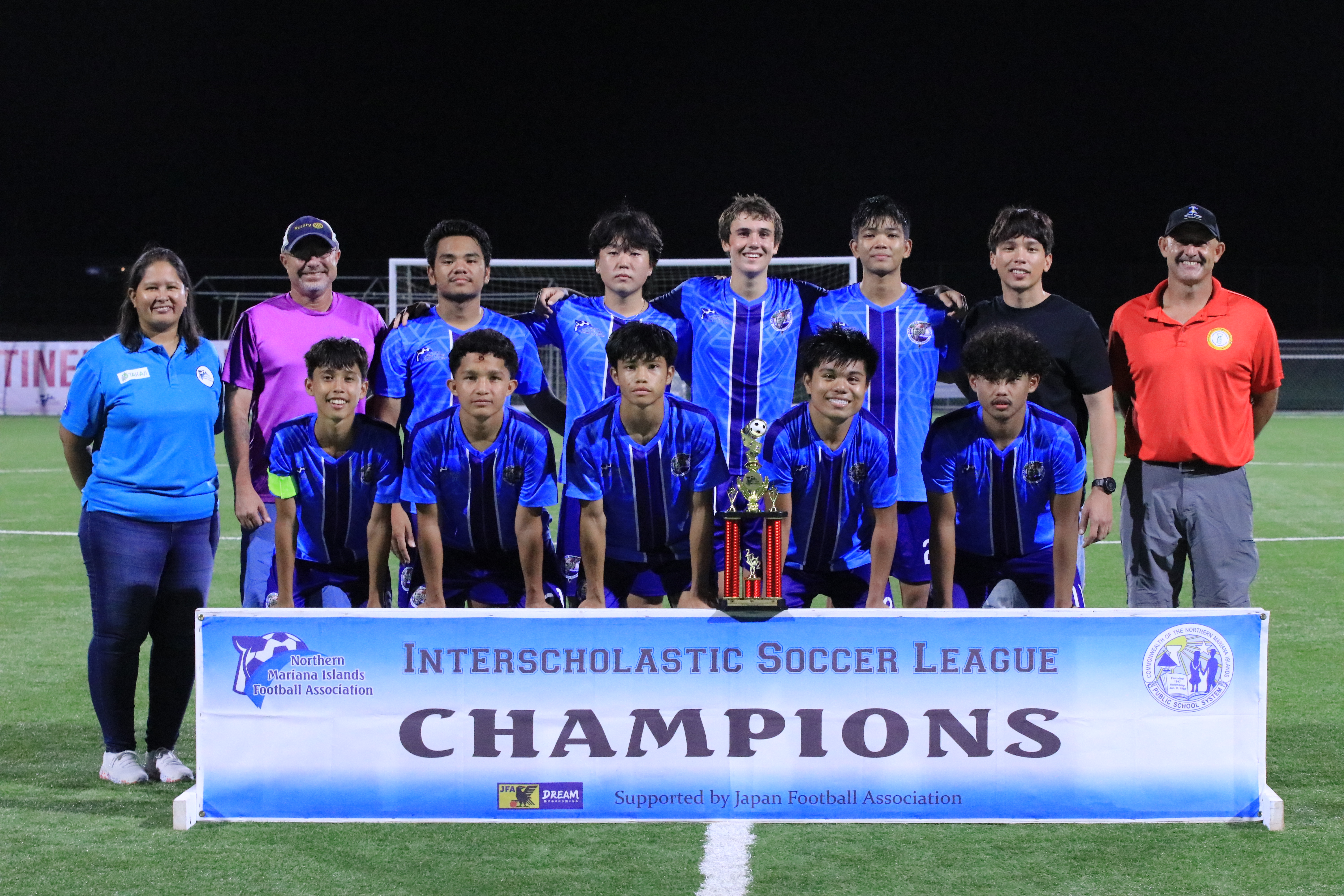 Marianas High School's varsity team members pose for a photo after winning the boys high school championship of the NMIFA-PSS Interscholastic Soccer League at the NMI Soccer Training Center on Tuesday.