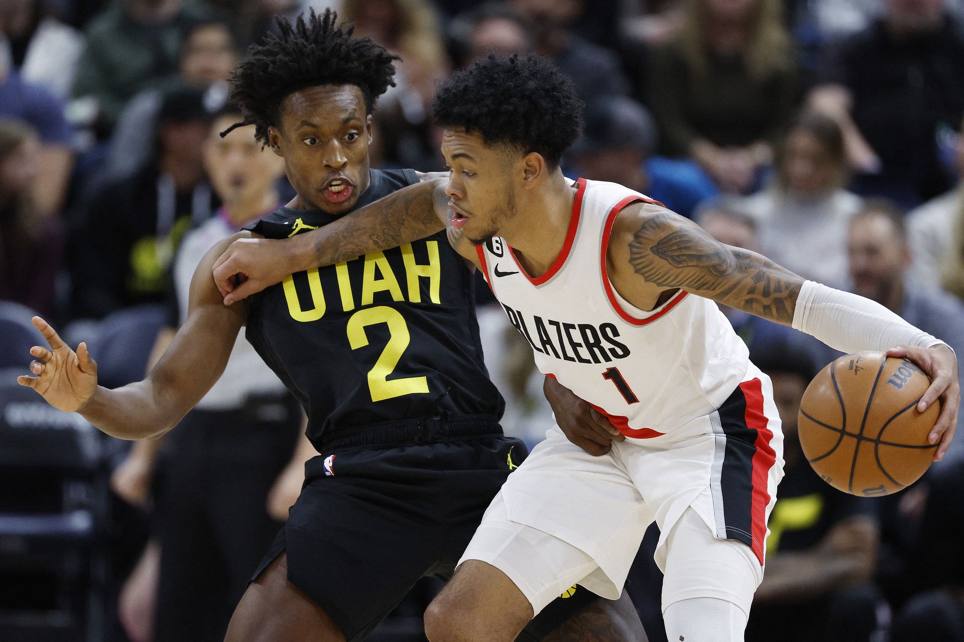 Utah Jazz guard Collin Sexton (2) guards Portland Trail Blazers guard Anfernee Simons (1) in the second half at Vivint Arena in Salt Lake City, Utah, Dec. 3, 2022.