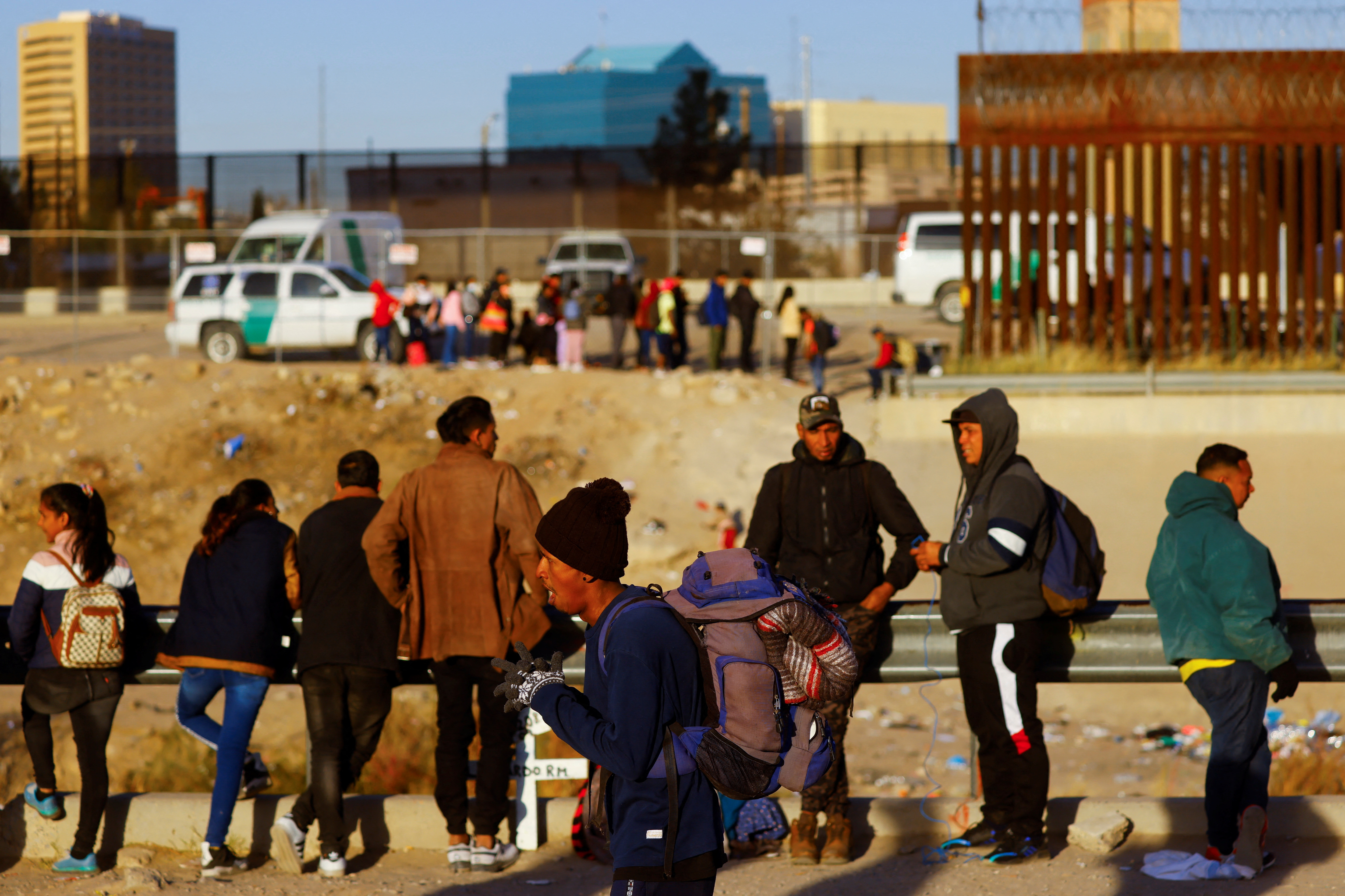 Venezuelan migrants stand near the Rio Bravo river, the border between the Mexico and the U.S., as they wait for the announcement about the end of Title 42 in Ciudad Juarez, Mexico on Dec. 17, 2022.