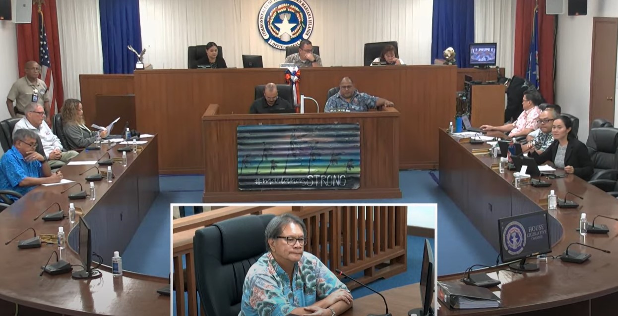 Bank of Saipan President John Z. Arroyo, center, appears before a joint House committee hearing on the BOOST program on Tuesday in the House chamber on Capital Hill.