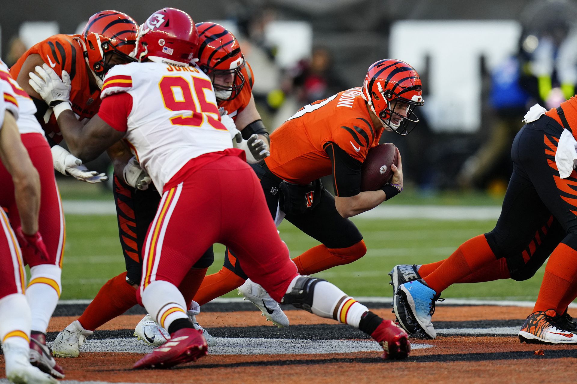 Cincinnati Bengals quarterback Joe Burrow (9) runs a QB sneak for a first down in the first quarter of a Week 13 NFL game at Paycor Stadium in Cincinnati, Ohio on Dec. 4, 2022.