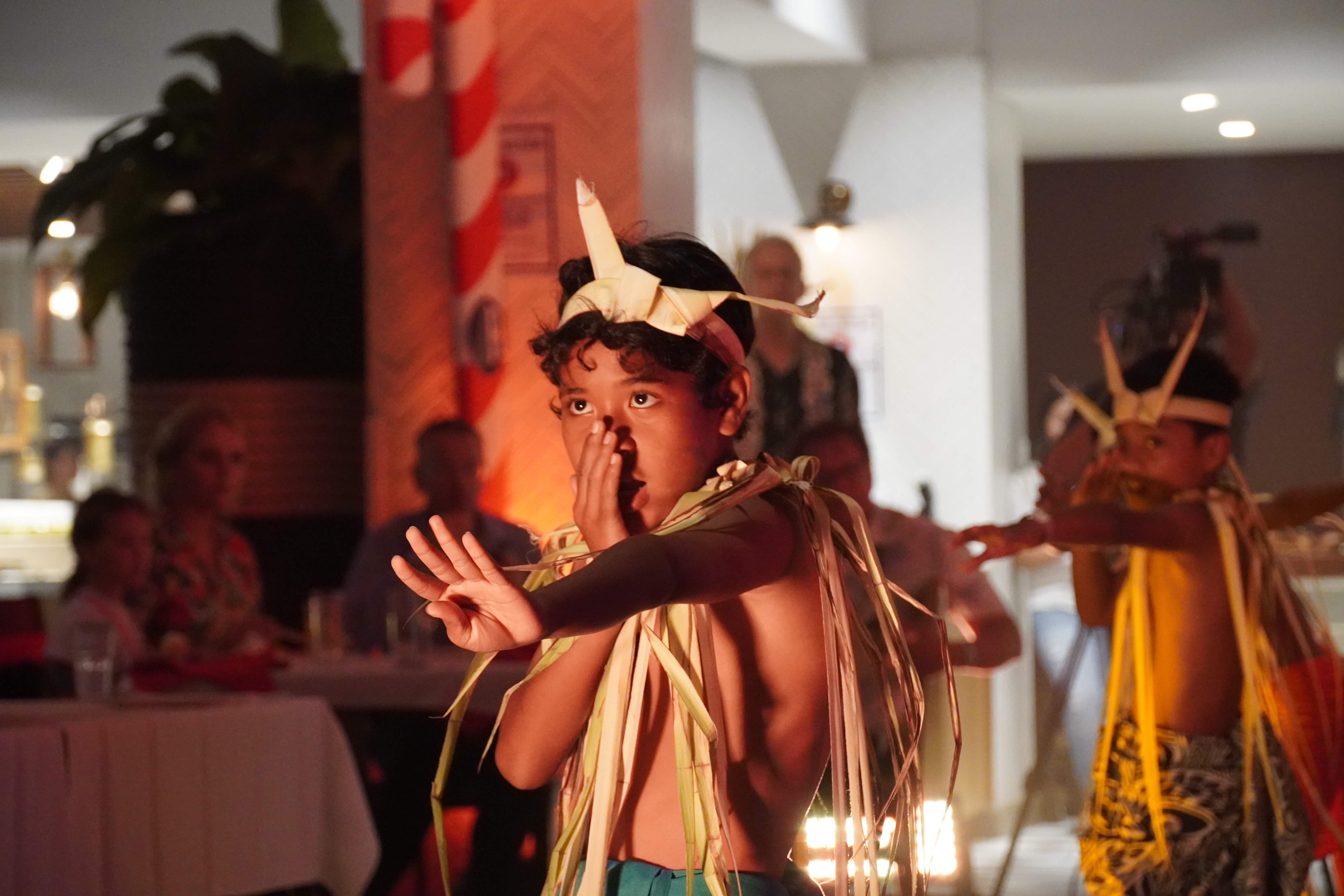 Young boys perform a Carolinian cultural dance.