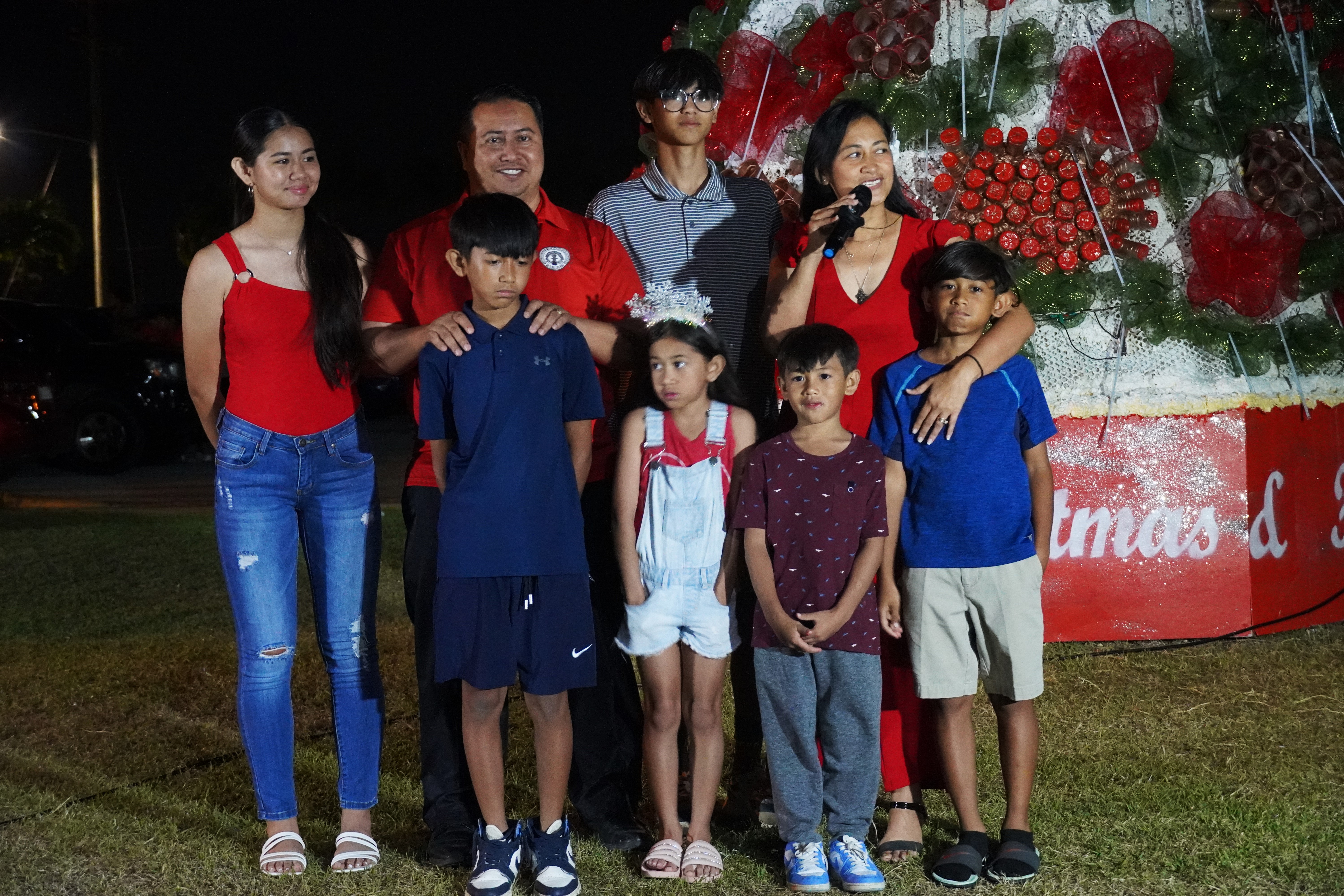 First lady Diann Torres speaks while her husband, Gov. Ralph DLG Torres, and their six children, Ralph Anthony, Vaniqa Marie, Deon Titus, Tristan Dane, Divannie and Ryan listen.
