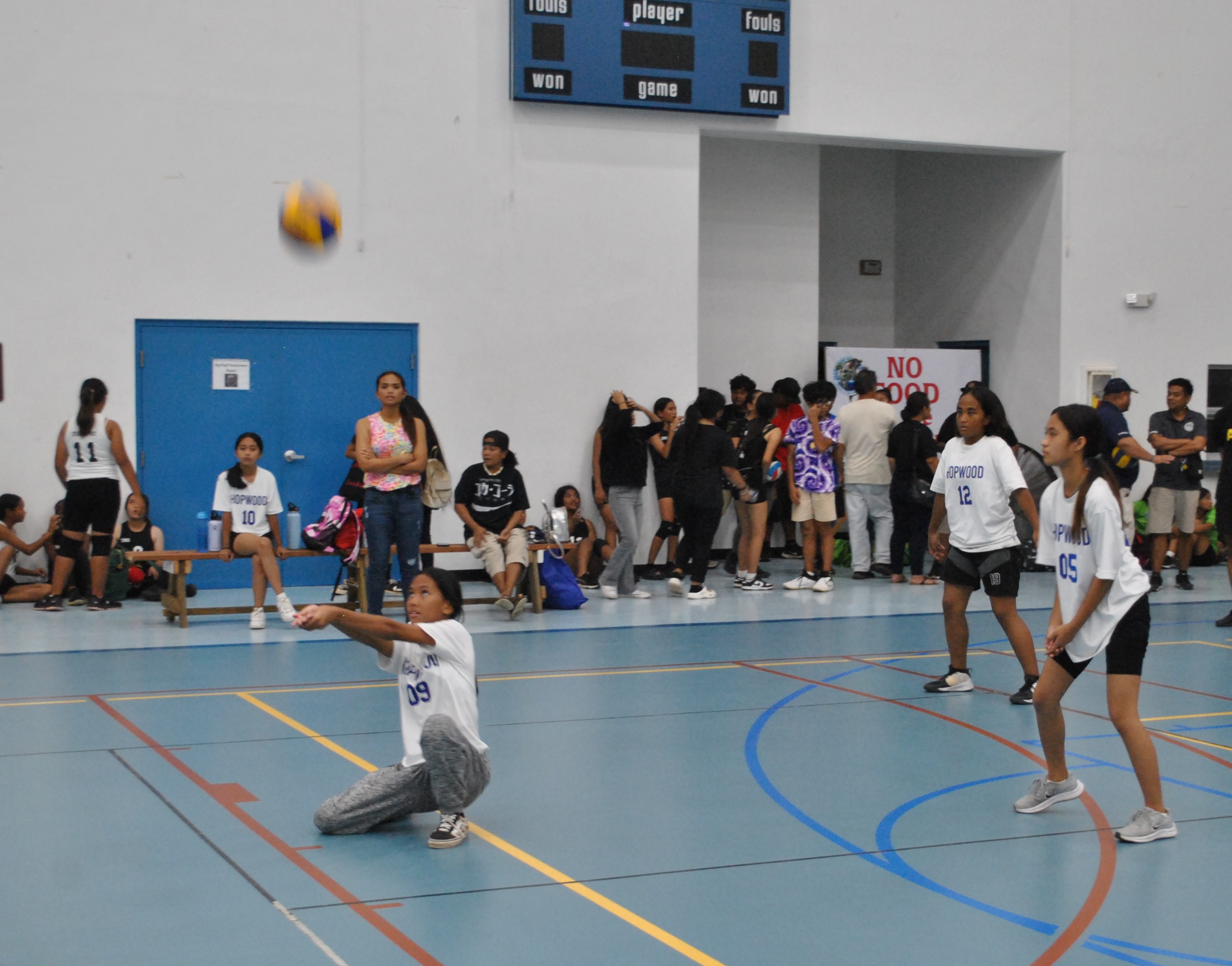 A Hopwood JV player extends for the return during an NMIVA-PSS Girls Middle School Volleyball League game at the MHS gym.