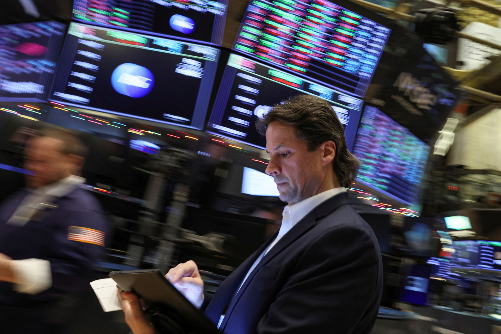 A trader works on the floor of the New York Stock Exchange  in New York City, Dec. 5, 2022.