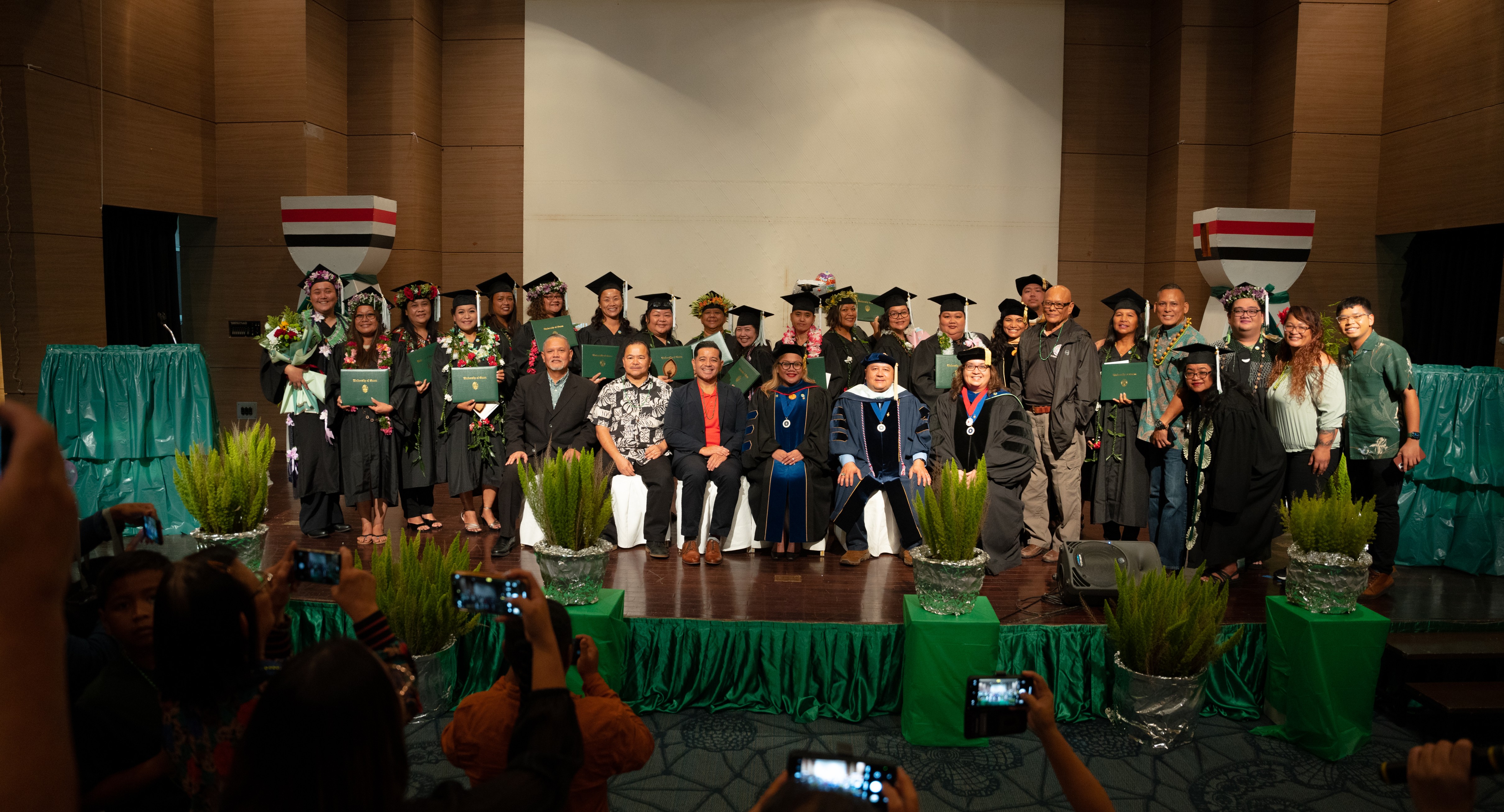 Seventeen Public School System educators from all Saipan, Tinian and Rota schools received their diplomas as members of the pioneer CHamoru Studies cohort on Wednesday at Saipan World Resort. Also in the photo are Commissioner of Education Dr. Alfred B. Ada, Northern Marianas College Vice President Frankie Eleptico, Board of Education Member Herman Atalig, University of Guam Interim Associate Dean of the College of Liberal Arts and Social Sciences Dr. Mary T.F. Cruz, UOG Senior Vice President And Provost Dr. Anita Borja Enriquez, UOG Interim Vice Provost For Academic Excellence Dr. Sharleen Santos-Bamba and PSS Chamorro & Carolinian Language Heritage Studies Program Director Jonas Barcinas.