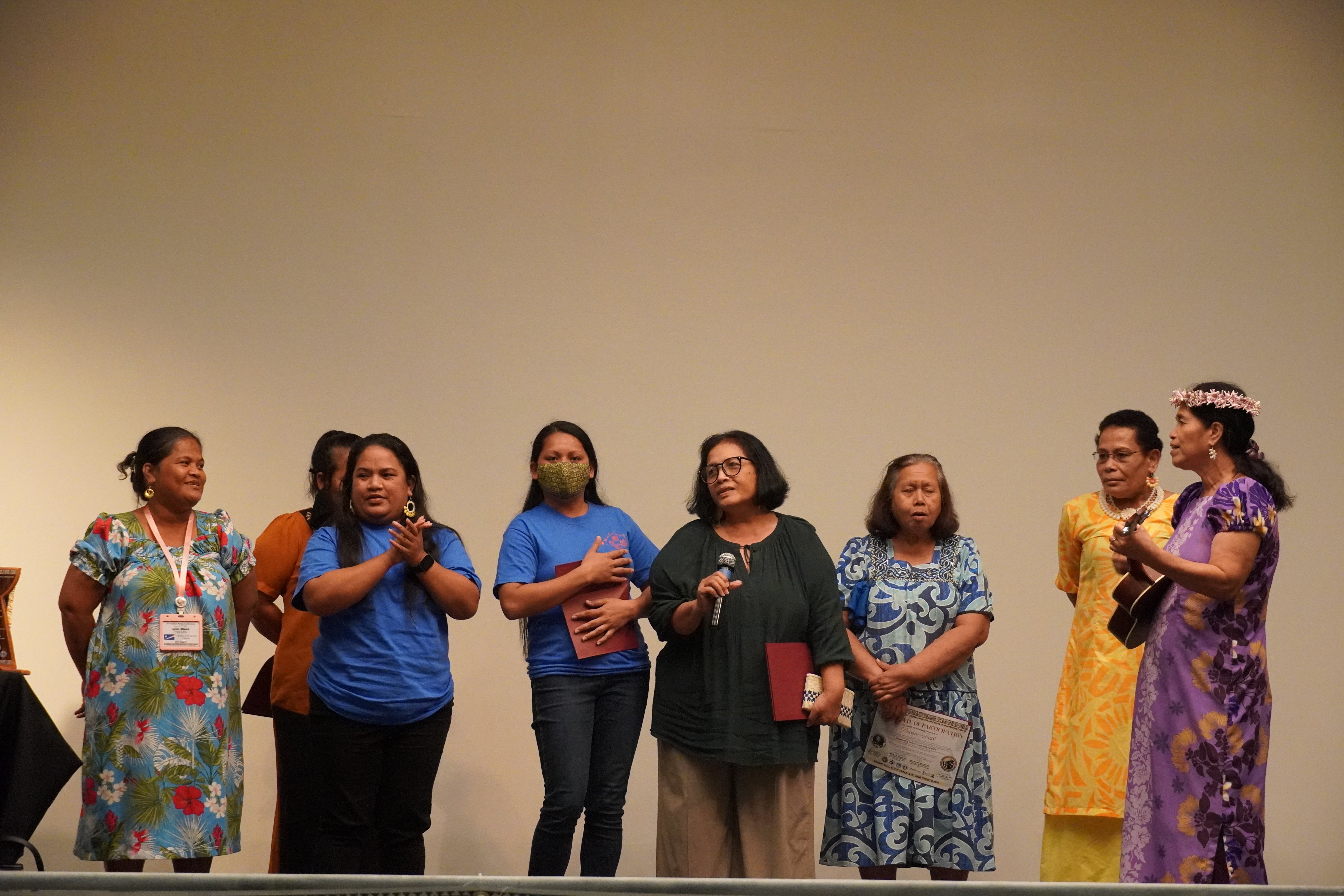 Marshall Islands delegates perform a musical number as part of their cultural gift exchange to the other delegates. 