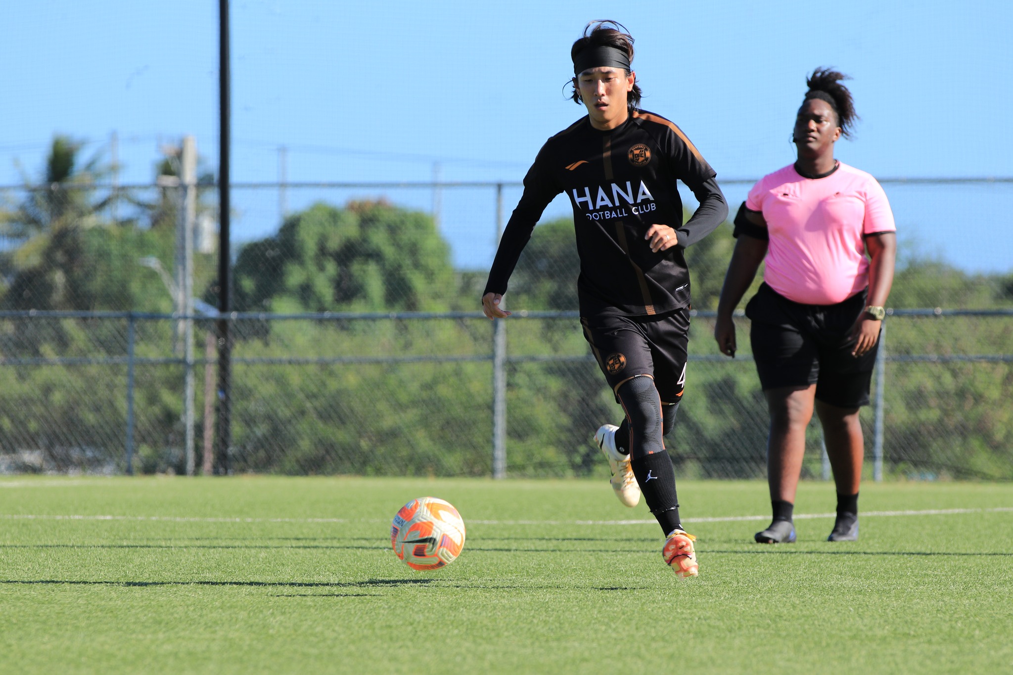 Hana's Scott Kim sets up the play during a Division “B” game of the Marianas Soccer League at the NMI Soccer Training Center in Koblerville.