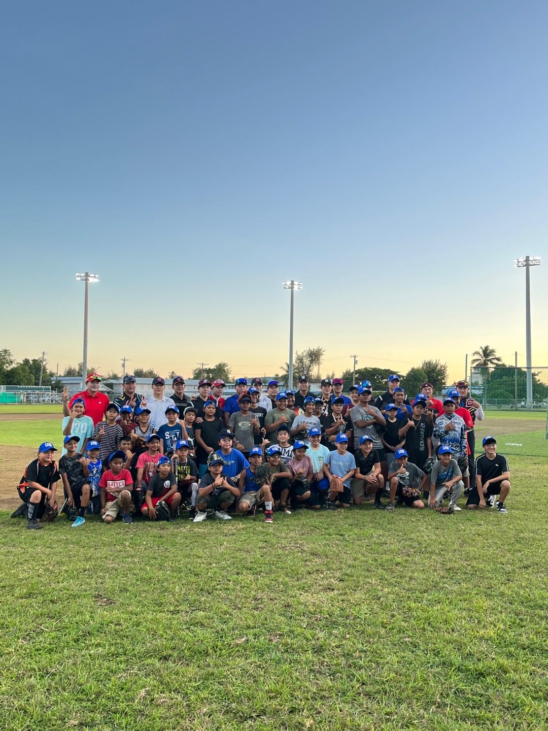 Professional baseball players of South Korea pose for a photo with CNMI Little League players and officials at the Oleai Sports Complex in Saipan on Dec. 14, 2022. 