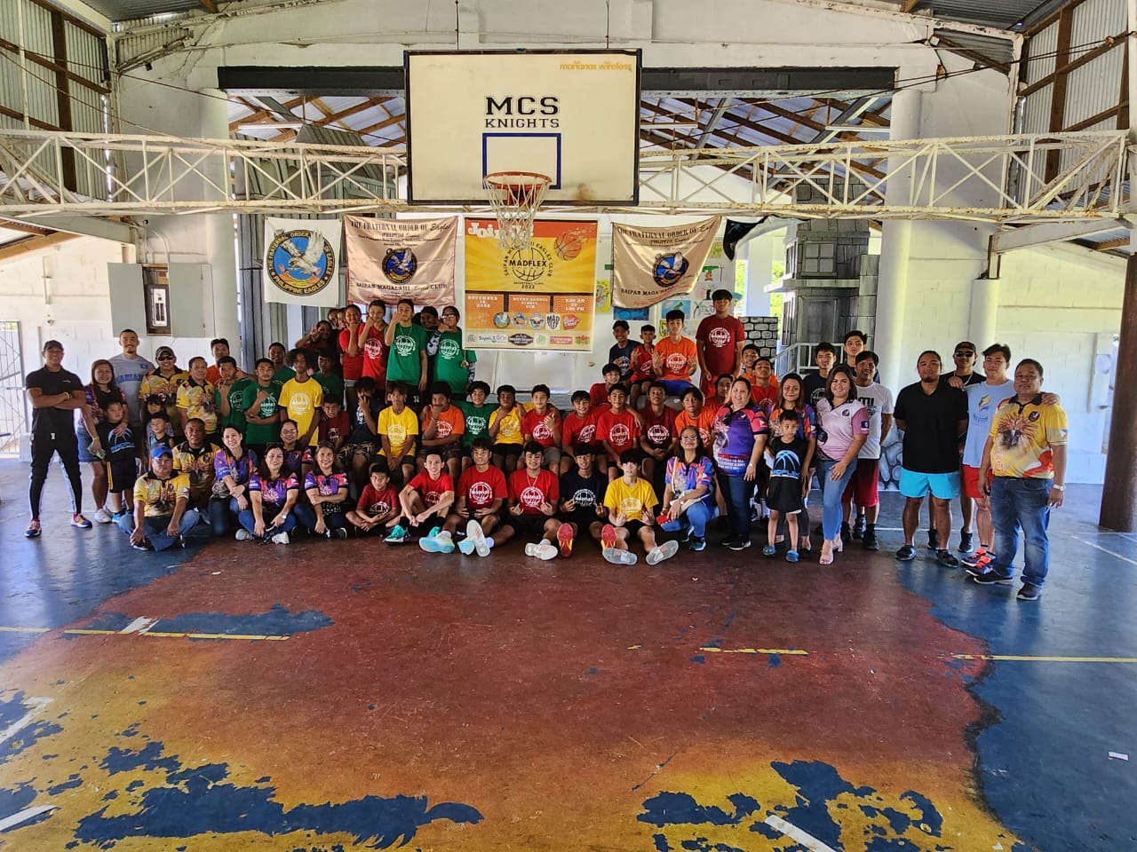 Saipan Magalahi Eagles Club members with the Saipan Maga'Haga Eagles Group, MadFlex Sports and basketball clinic participants at the MCS gym.