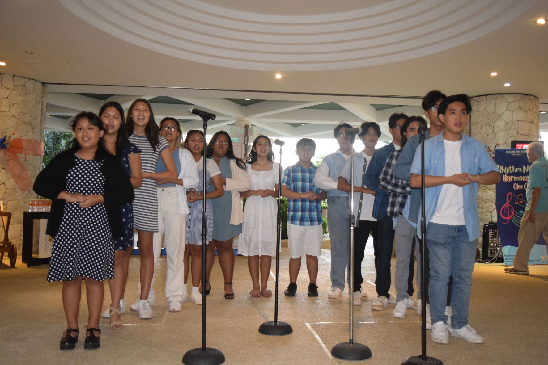 Members of the Marianas High School Glee Club, Rhythm ‘N Harmony, sing a Christmas carol at Hyatt Regency Saipan on Friday.