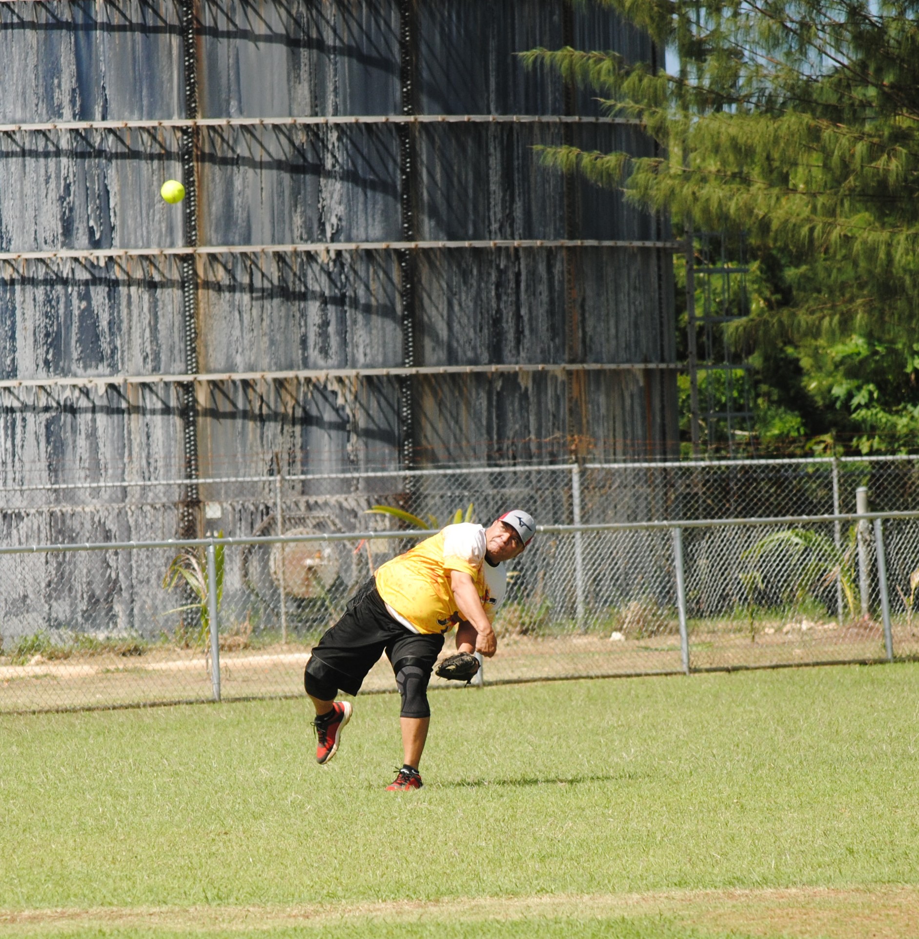Hagu Lamun shortstop Glen Camacho throws infield during a men's division game of the 2022 Budweiser Belau Amateur Softball League at the Dandan baseball field.