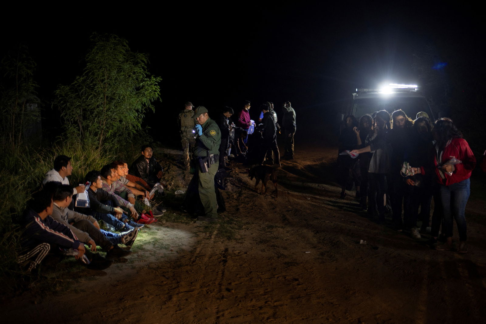 Border patrol agents process asylum seeking migrants from Central America who were smuggled from Mexico into Roma, Texas, Nov. 6, 2022.