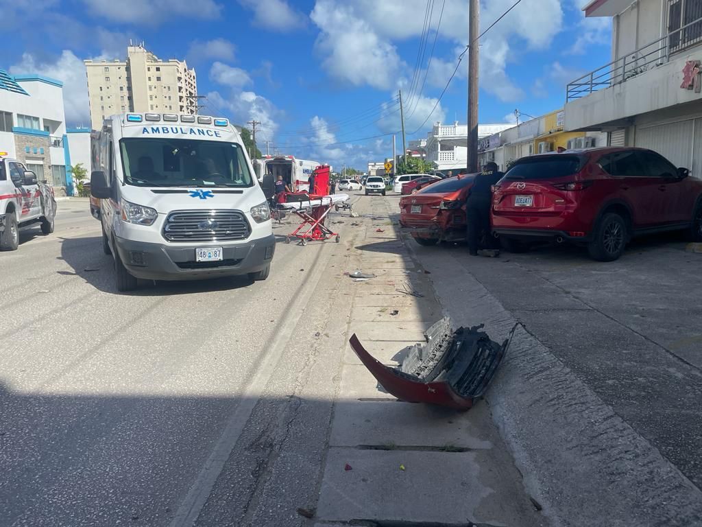 The detached rear bumper of the other car involved in a two-vehicle collision can be seen on the ground Thursday morning on Beach Road in Chalan Kanoa.