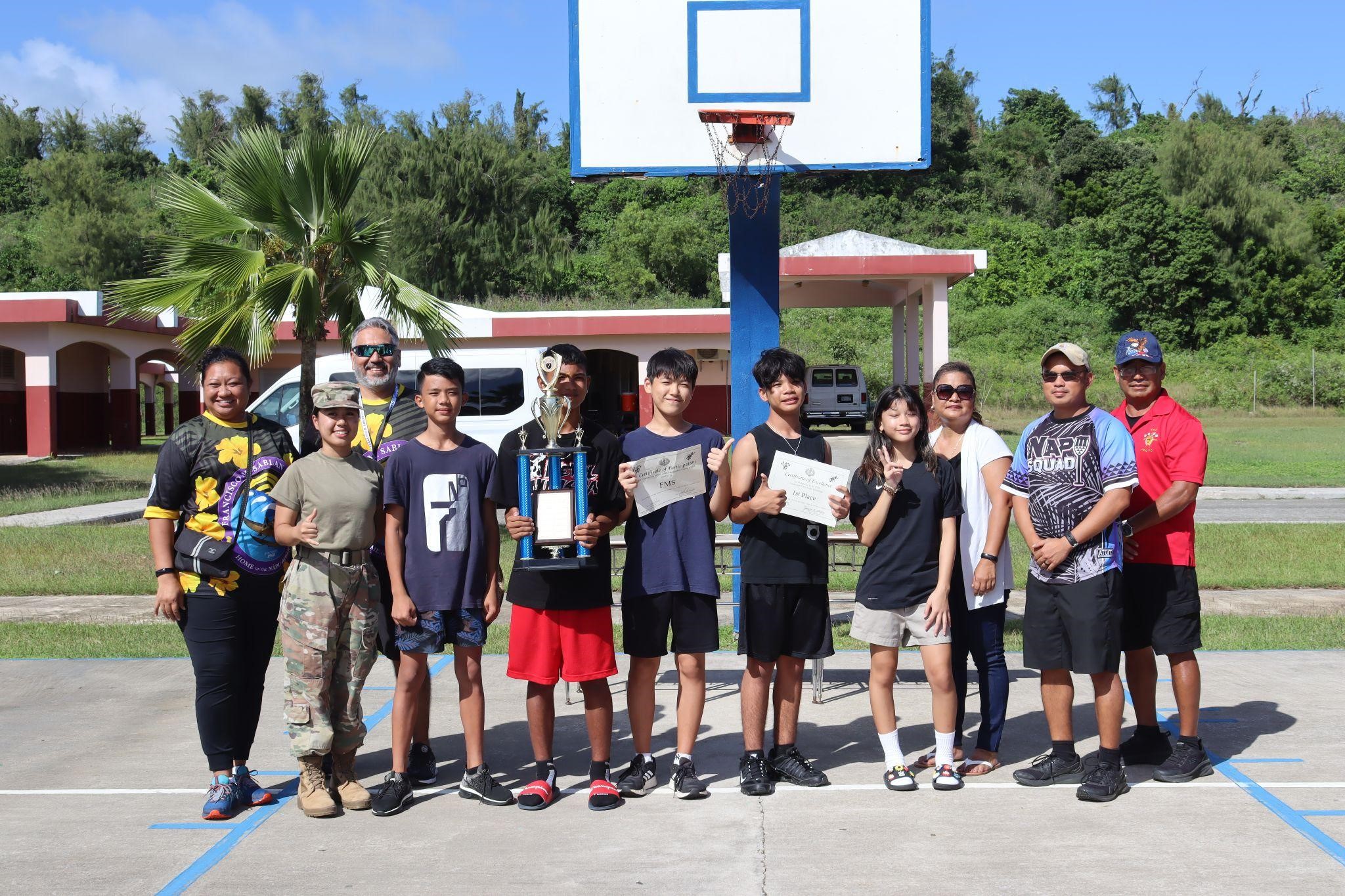 Students of Francisco M. Sablan Middle School poses as they earn their 1st place trophy.