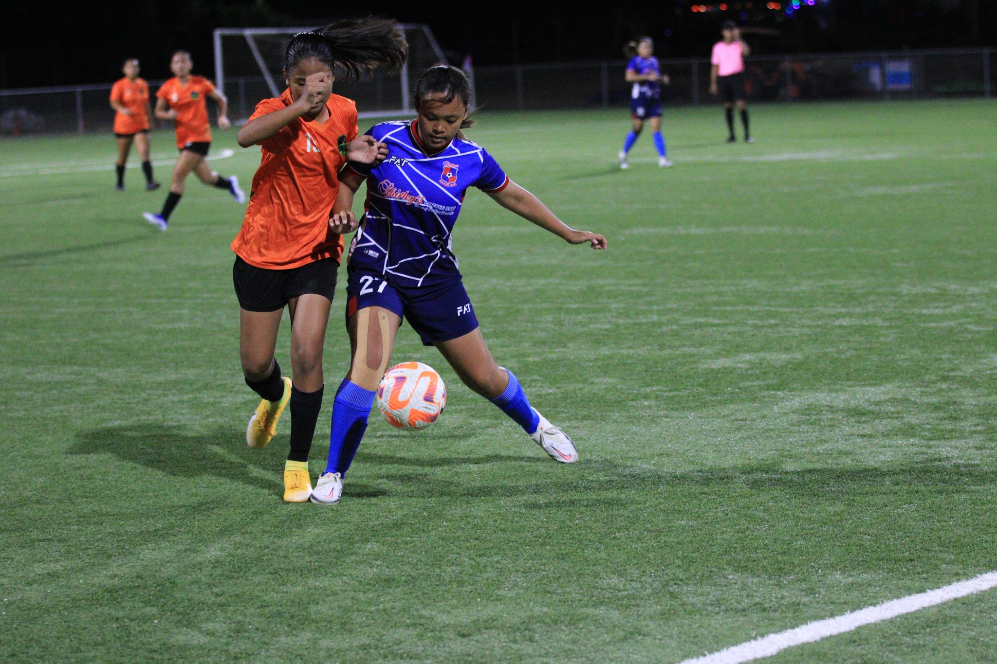Shirley's Neriah Lumbad protects the possession from a Kanoa player during a Premier Division game of the 2022 Dove Women's League at the NMI Soccer Training Center.