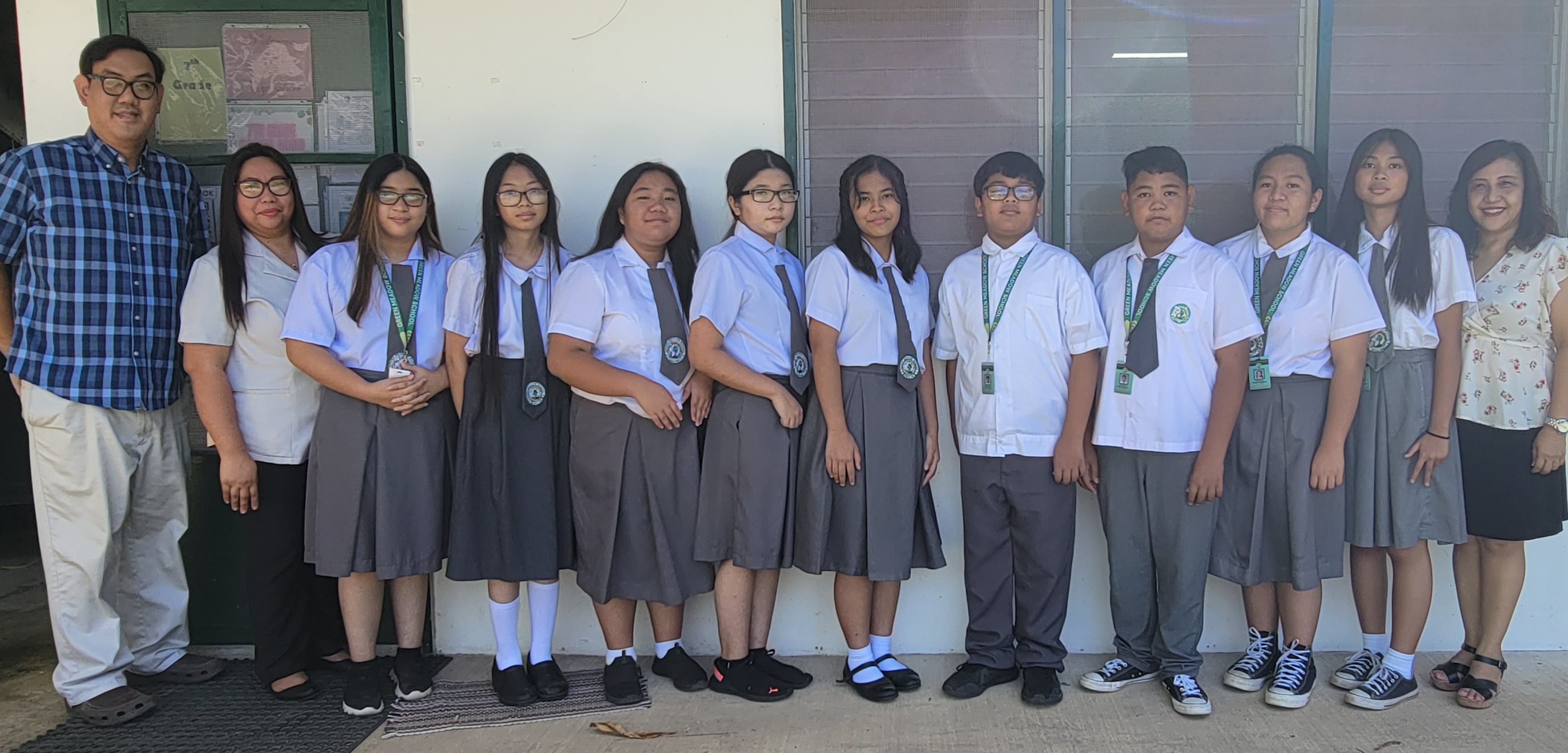 Green Meadow School middle school students who participated in the recent thespian and forensic competitions pose for a photo with their teachers and school president Glenn Songcuan, left.