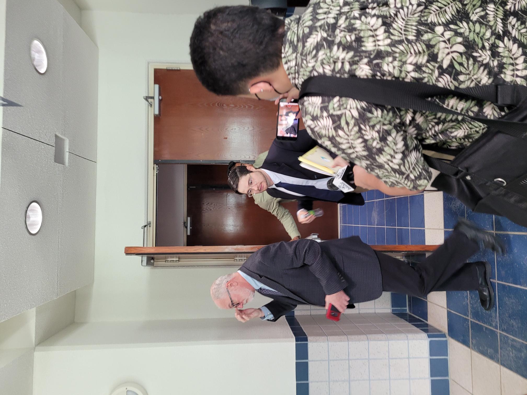 Chief Solicitor J. Robert Glass Jr., center, and Assistant Attorney General Steven Kessel, left, exit a courtroom after a status conference hearing on Monday afternoon.