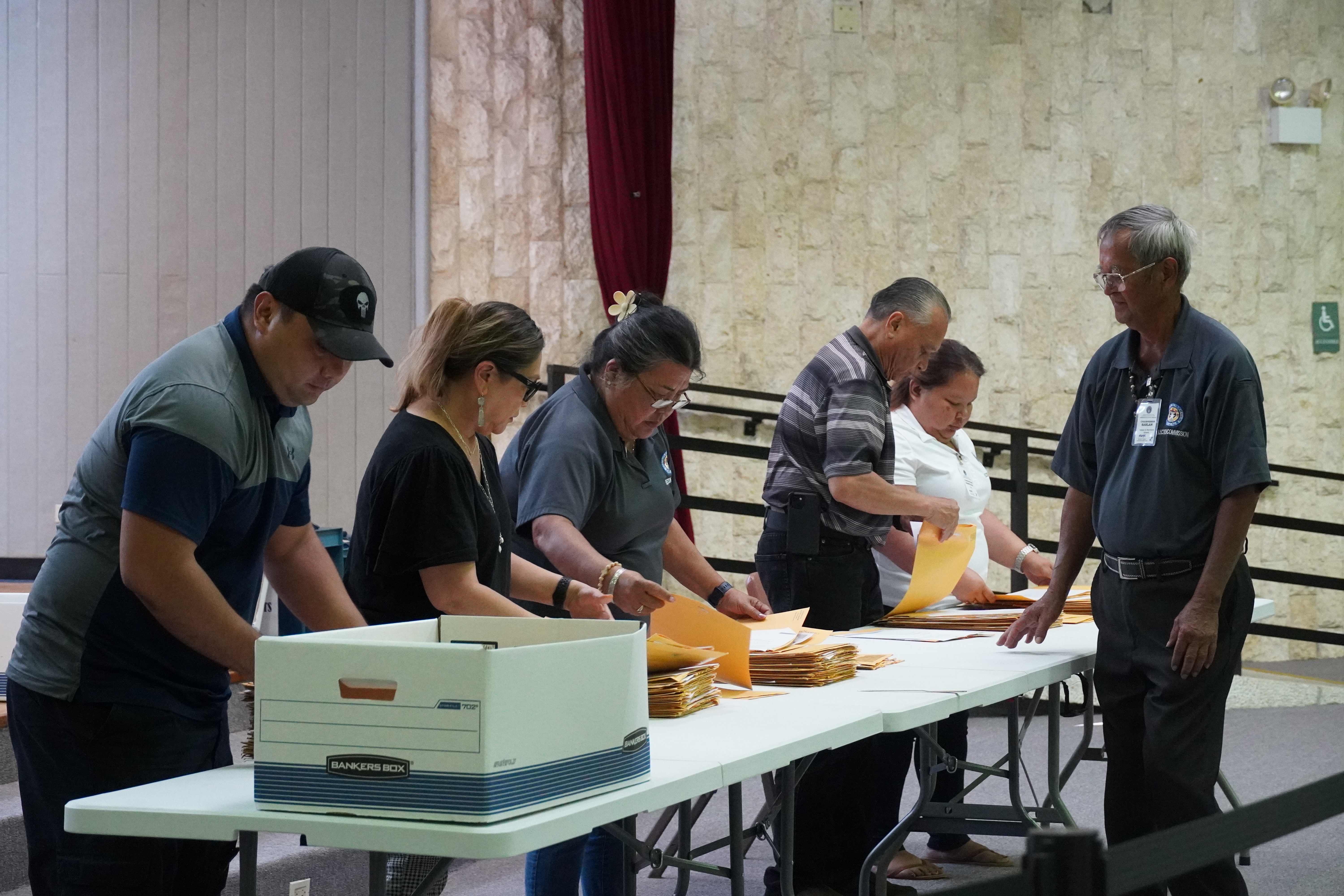 Election board chair Jesus I. Sablan observes each of the election commissioners' work.