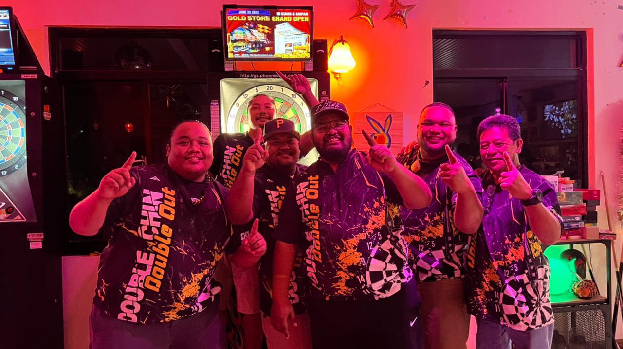 The players of JC Double Chin Double Out pose for a photo after winning the Thursday B Fanihi Division Bud Light Cup  of the SEDA Bud Light Dart League at Just Chillin’ Bar.