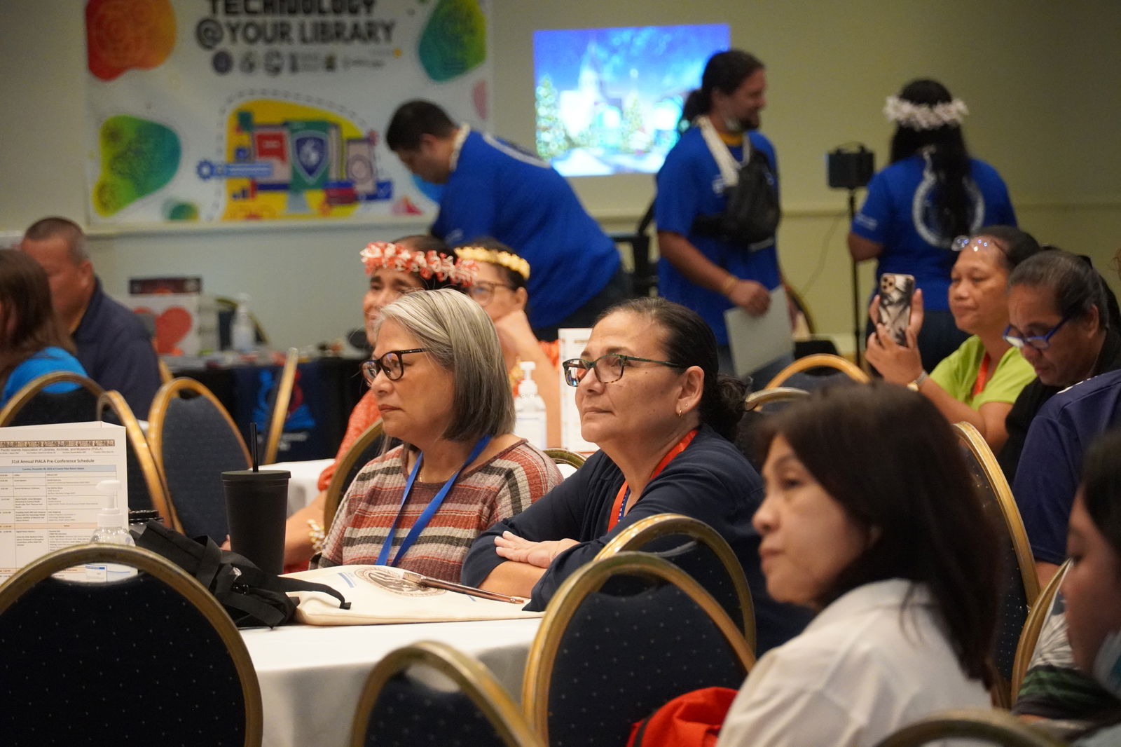 Delegates from Guam, the FSM, and the Marshall Islands listen to remarks made during the opening ceremony.