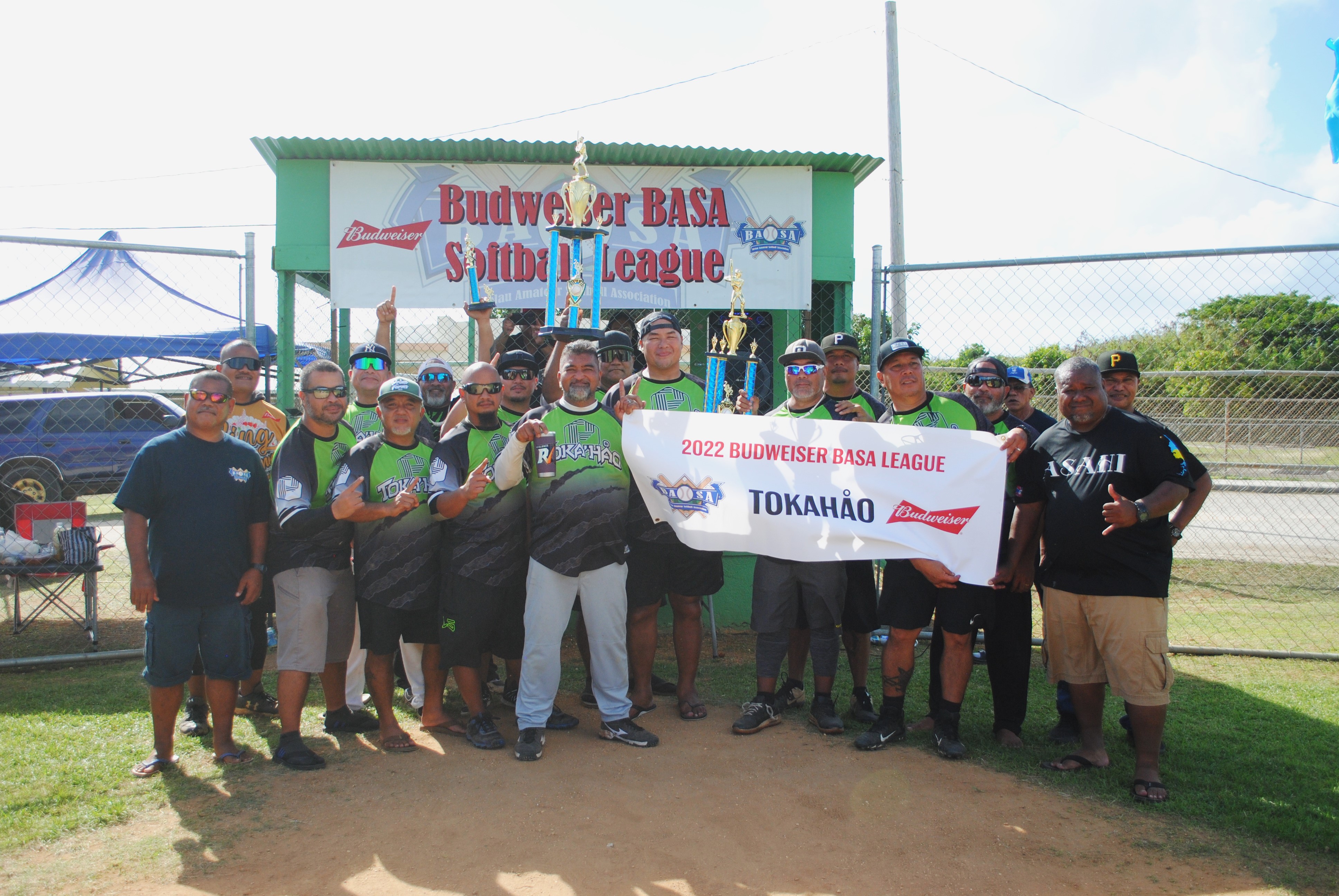 Tokahao players pose with the championship trophy during the awards ceremony of the 2022 Budweiser Belau Amateur Softball League Sunday at the Dandan baseball field.
