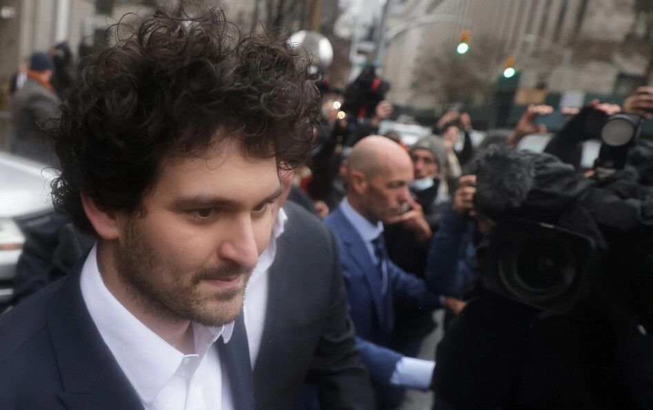 Former FTX chief executive Sam Bankman-Fried, who faces fraud charges over the collapse of the bankrupt cryptocurrency exchange, walks from the Manhattan federal court after securing bail in New York City, Dec. 22, 2022.