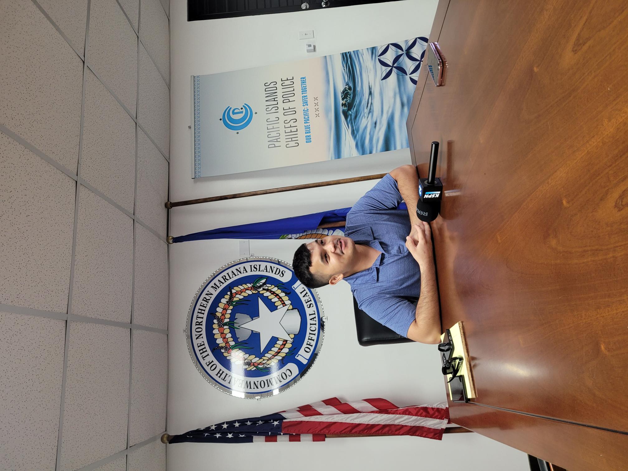 Department of Public Safety public information officer Dre Pangelinan conducts a press conference Monday.