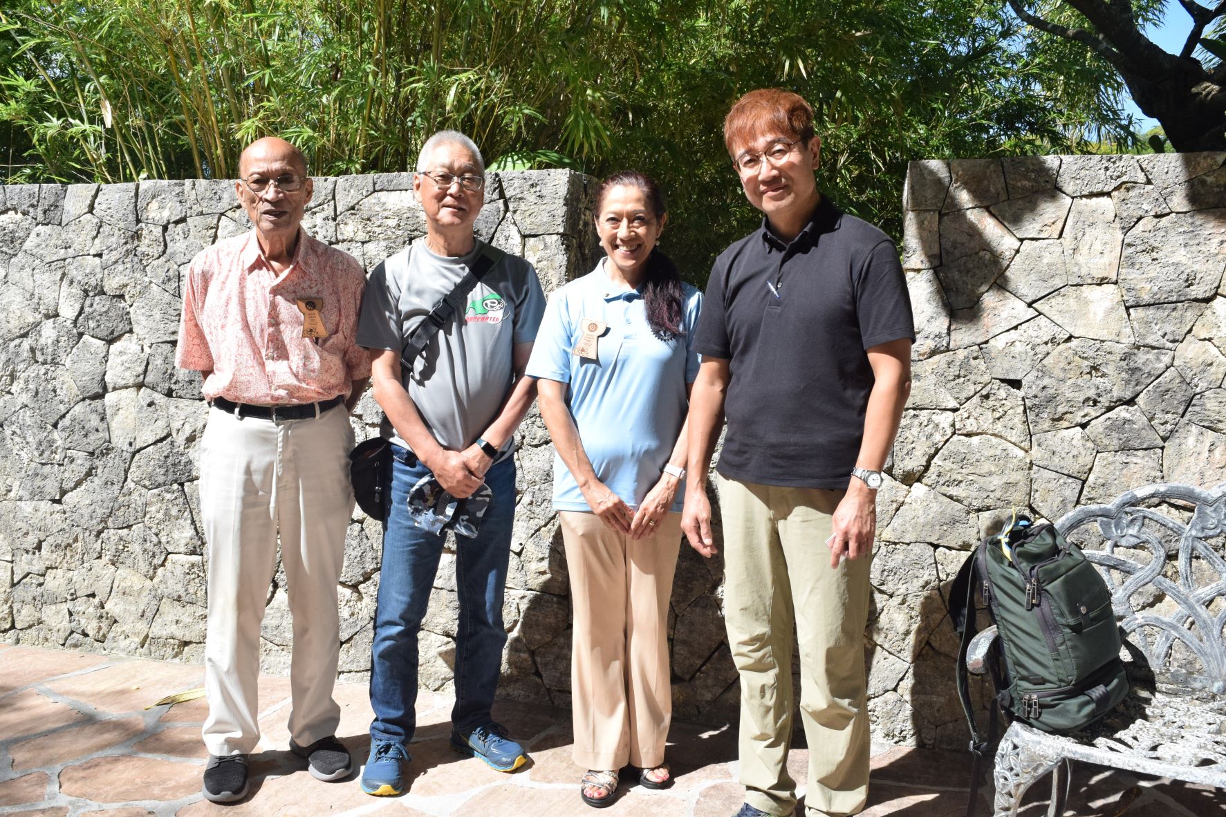 Temjin TV director Hiroshi Masuda, right, and cameraman Shigeo Nakaya, second left, pose for a photo with Rotarians David "Uncle Dave" M. Sablan, left, and Hiroko Stewart after the Rotary Club of Saipan's meeting on Tuesday at Hyatt Regency Saipan's Giovanni's Restaurant.