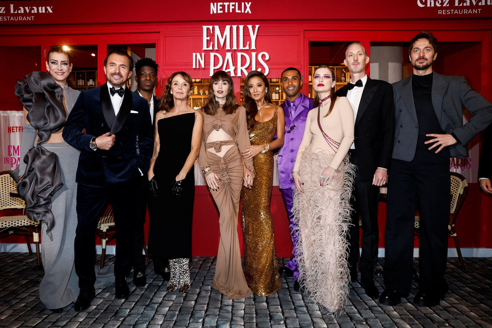 Kate Walsh, William Abadie, Philippine Leroy-Beaulieu, Samuel Arnold, Lily Collins, Ashley Park, Lucien Laviscount, Camille Razat, Bruno Gouery and Lucas Bravo attend the world premiere of the third season of the Netflix series "Emily in Paris" at the Theatre des Champs Elysees in Paris, France, Dec. 6, 2022.