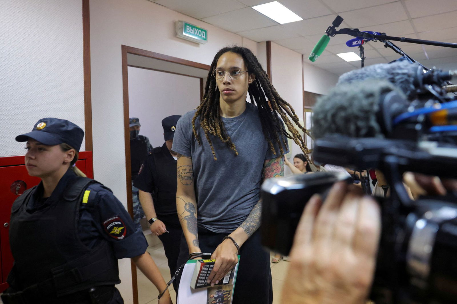 U.S. basketball player Brittney Griner, who was detained at Moscow's Sheremetyevo airport and later charged with illegal possession of cannabis, is escorted before the verdict in Khimki outside Moscow, Russia, Aug. 4, 2022.