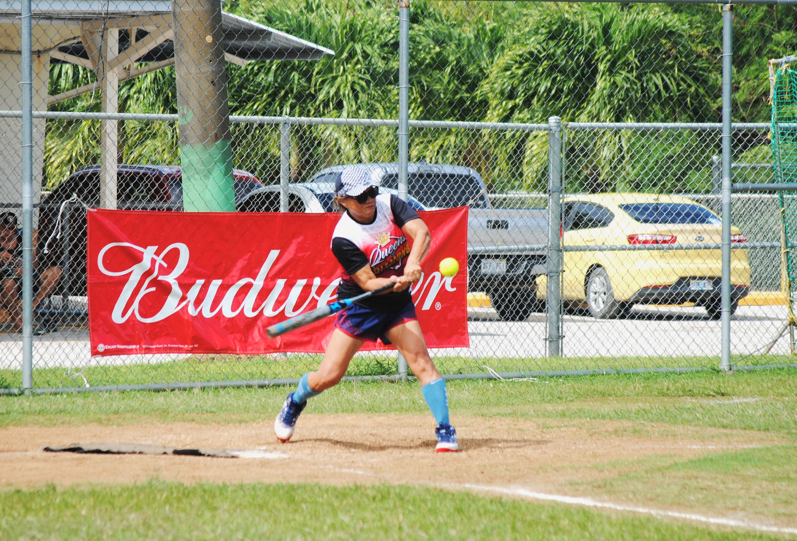 The Queens of Diamonds' Thelma Mizer connects the single during game 1 of the women's division championship of the 2022 Budweiser Belau Amateur Softball League on Saturday at Dandan baseball field.