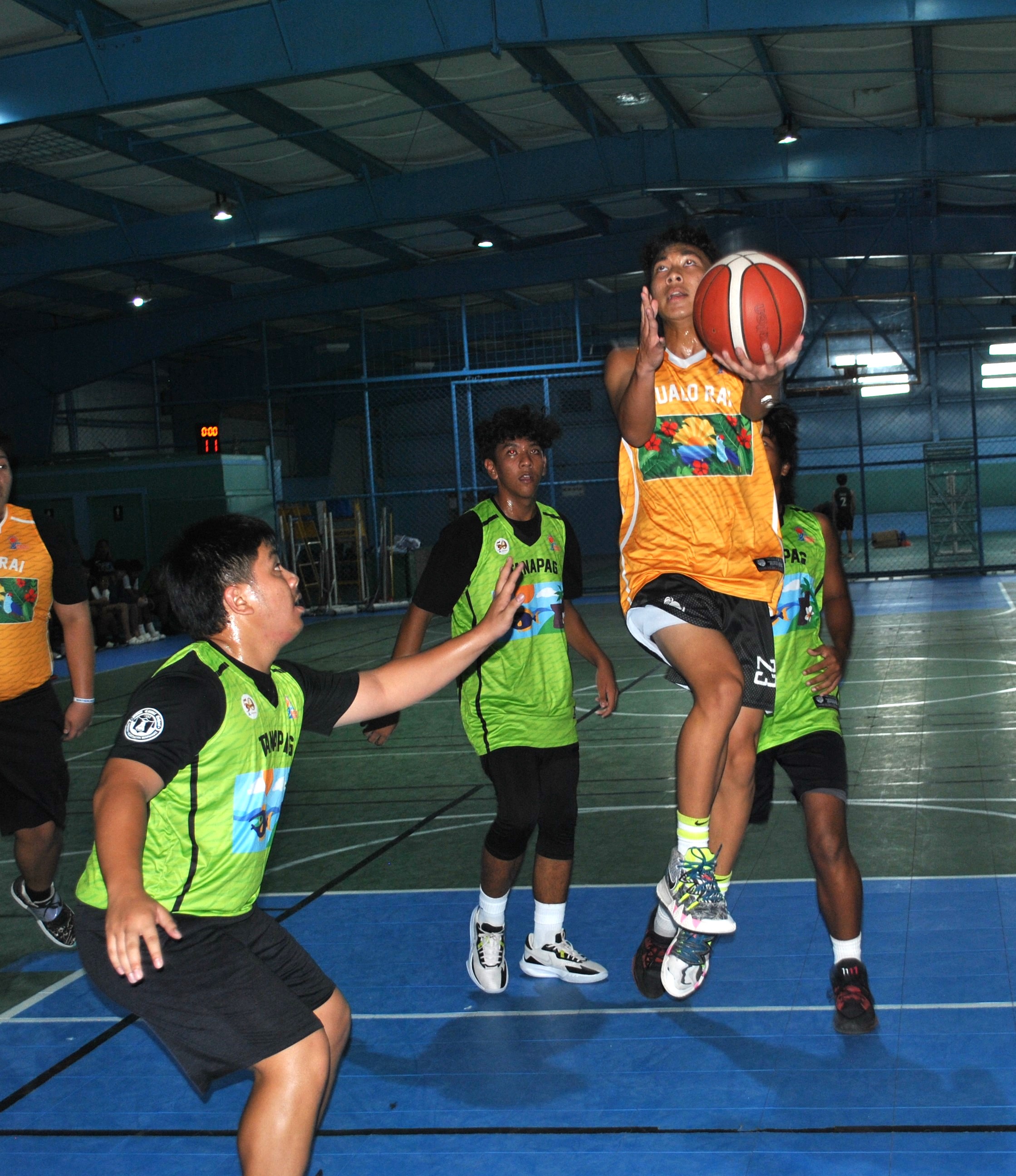 Gualo Rai's Derek Sasamoto extends for the left hand finish during a U18 boys division game of the 2022 Marianas Village Pride Basketball League on Saturday at the TSL Sports Complex.