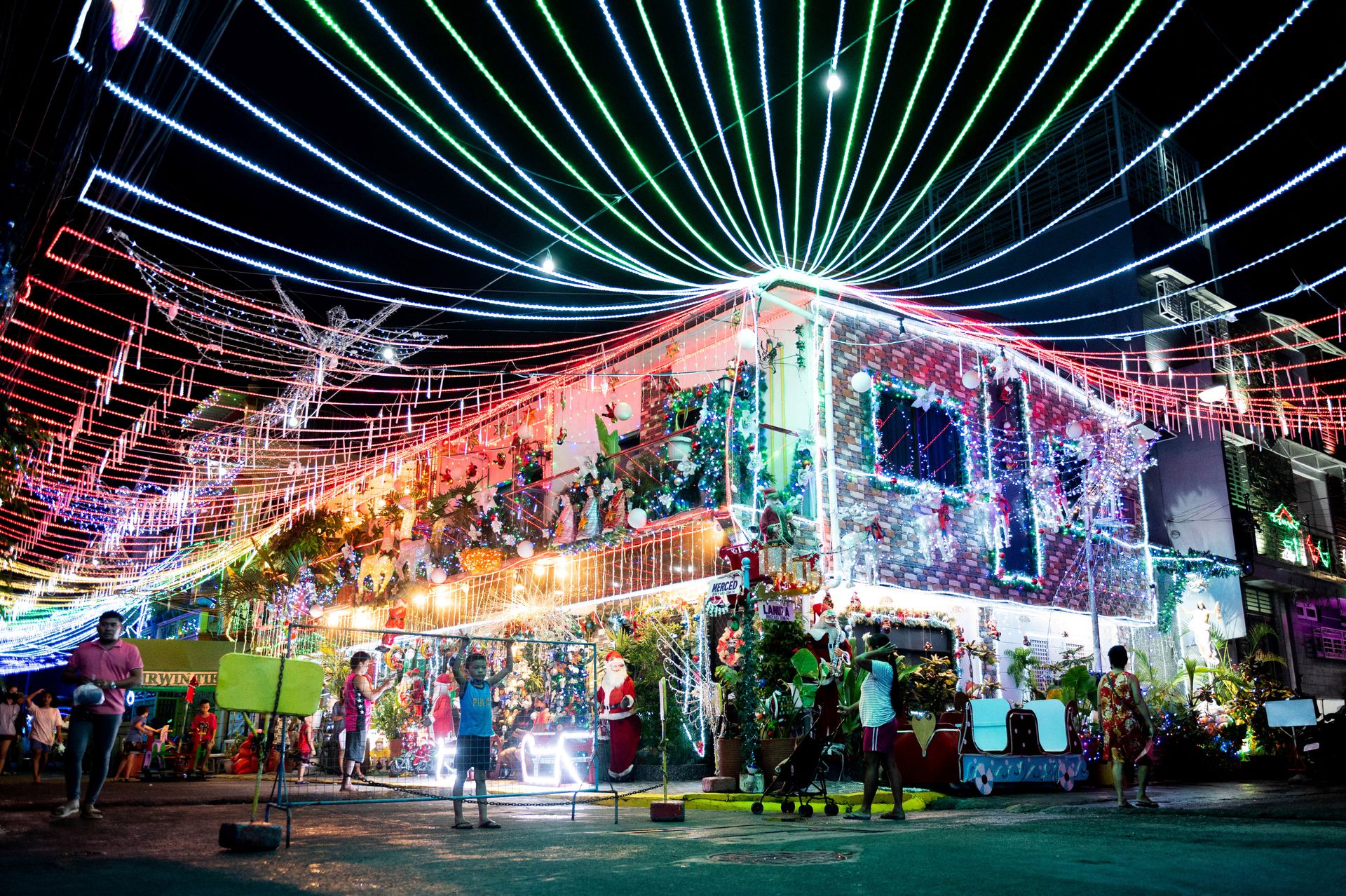 People visit the Christmas-themed house in Manila, the Philippines, Dec. 14, 2022.